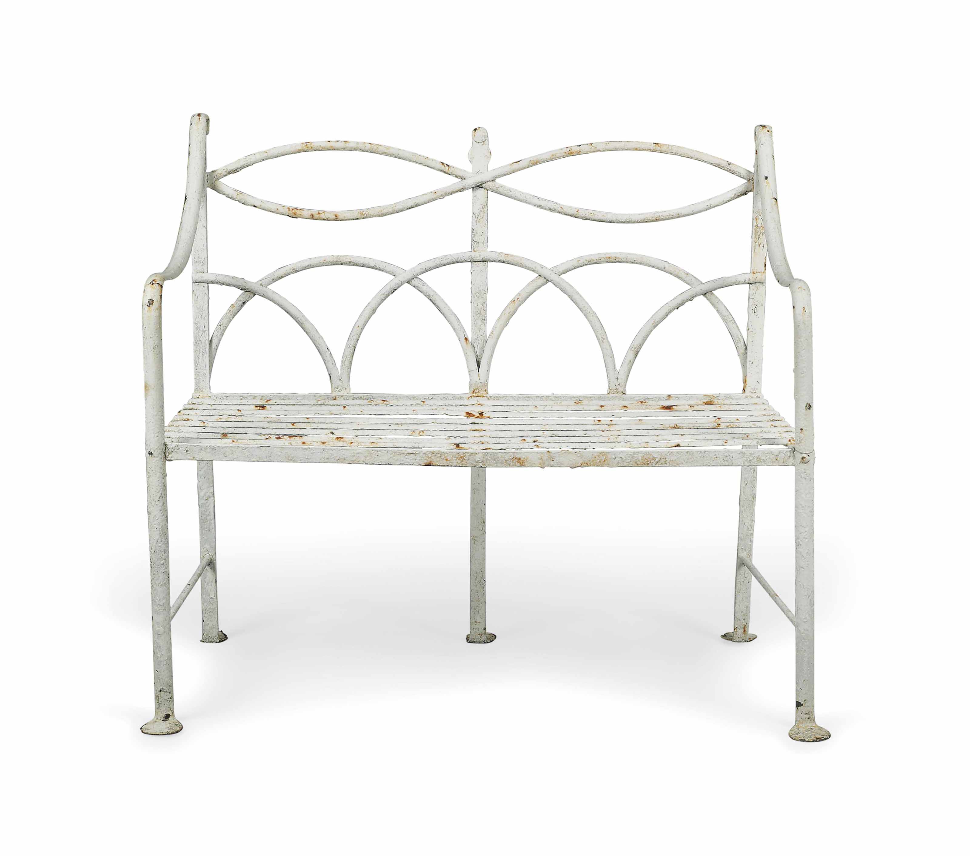 A REGENCY WHITE PAINTED WROUGHTIRON GARDEN BENCH , EARLY 19TH CENTURY