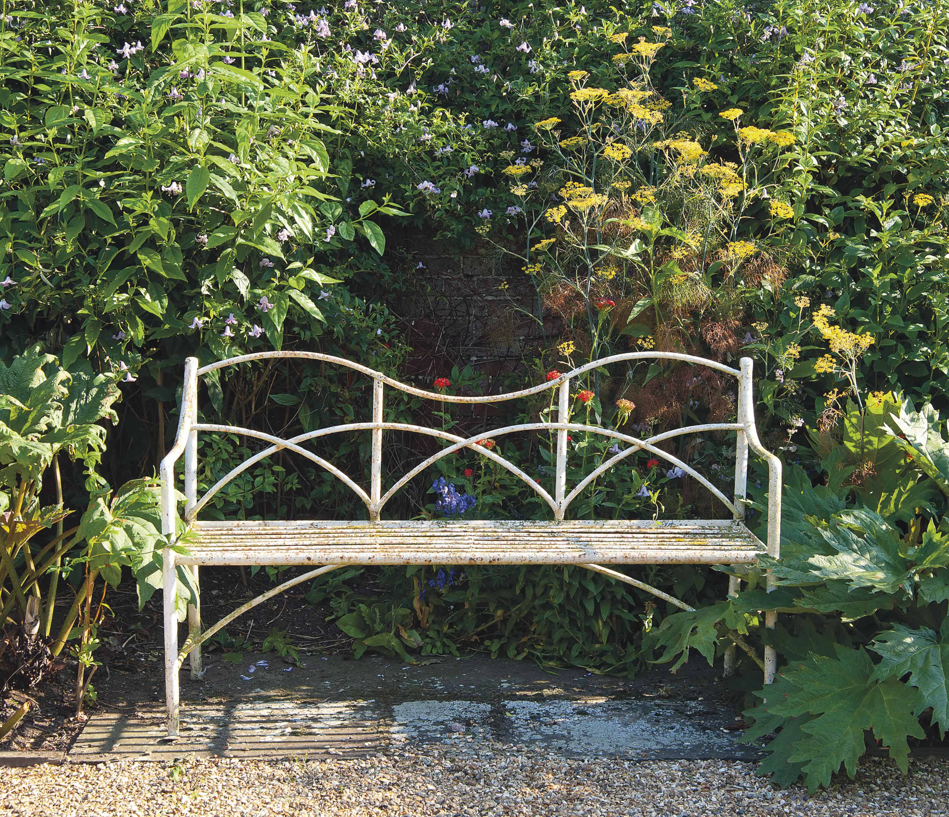 A White Painted Wrought Iron Garden Bench 19th Century Bench