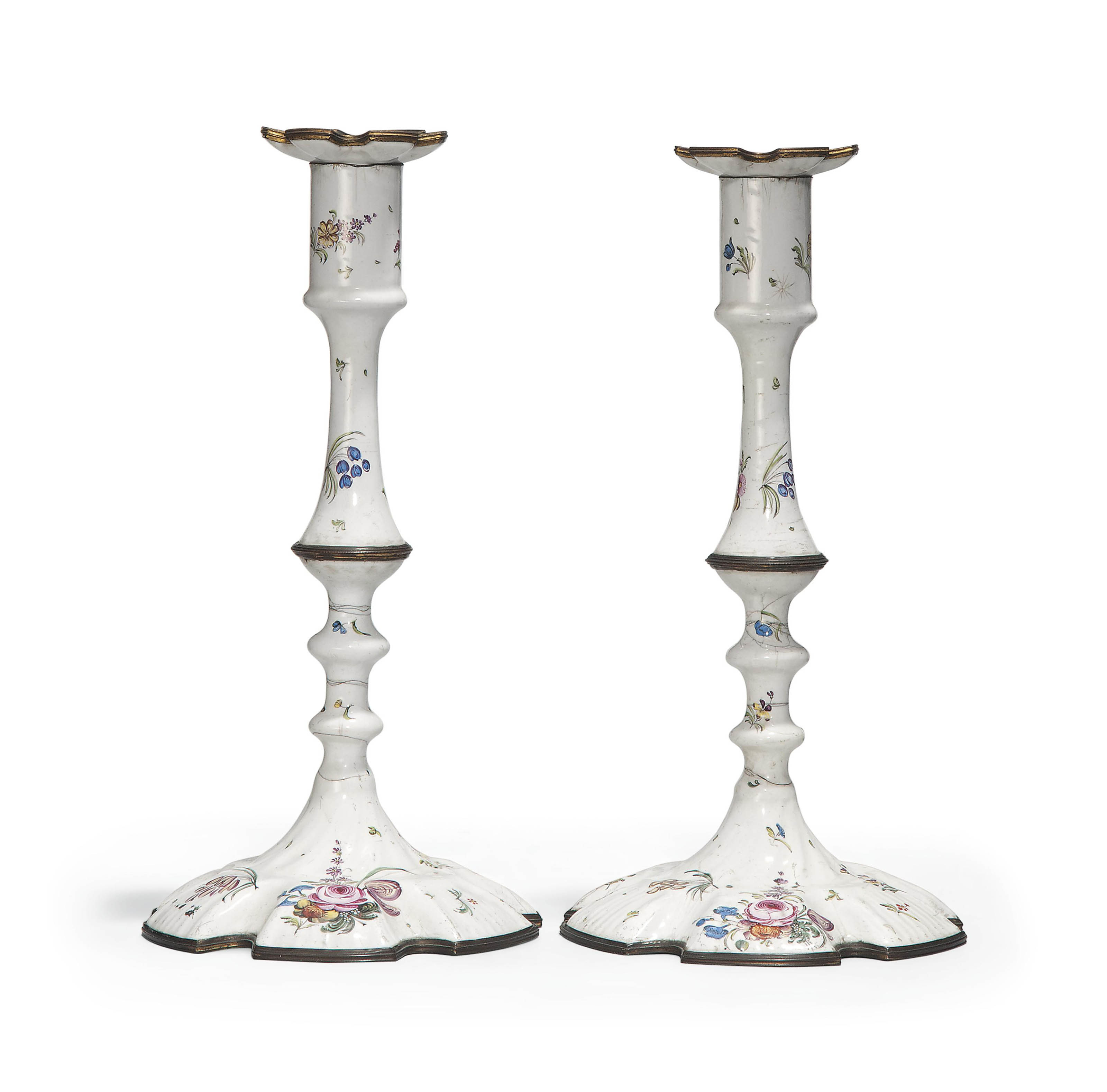 A PAIR OF STAFFORDSHIRE ENAMEL CANDLESTICKS , CIRCA 1760 Christie's