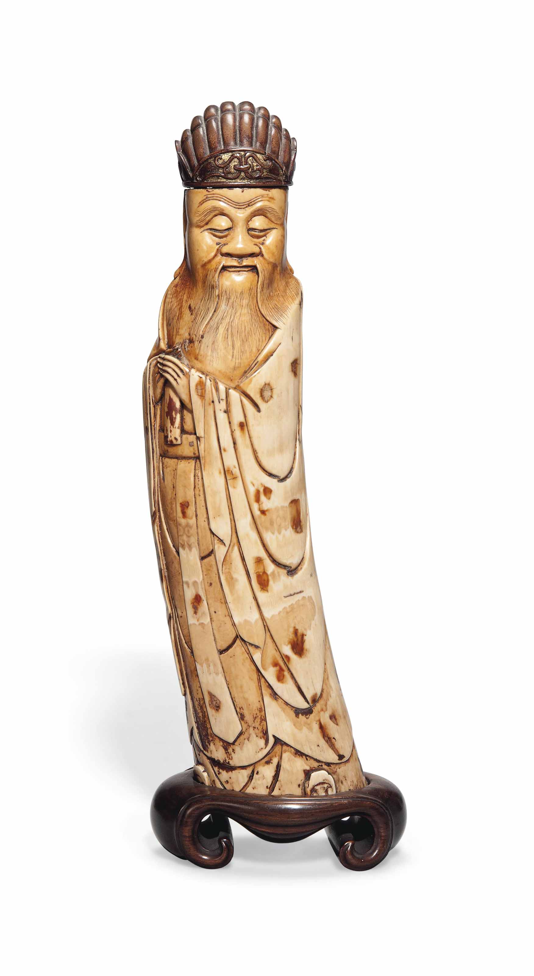 A CHINESE IVORY CARVING OF A STANDING IMMORTAL , 17TH CENTURY OR LATER