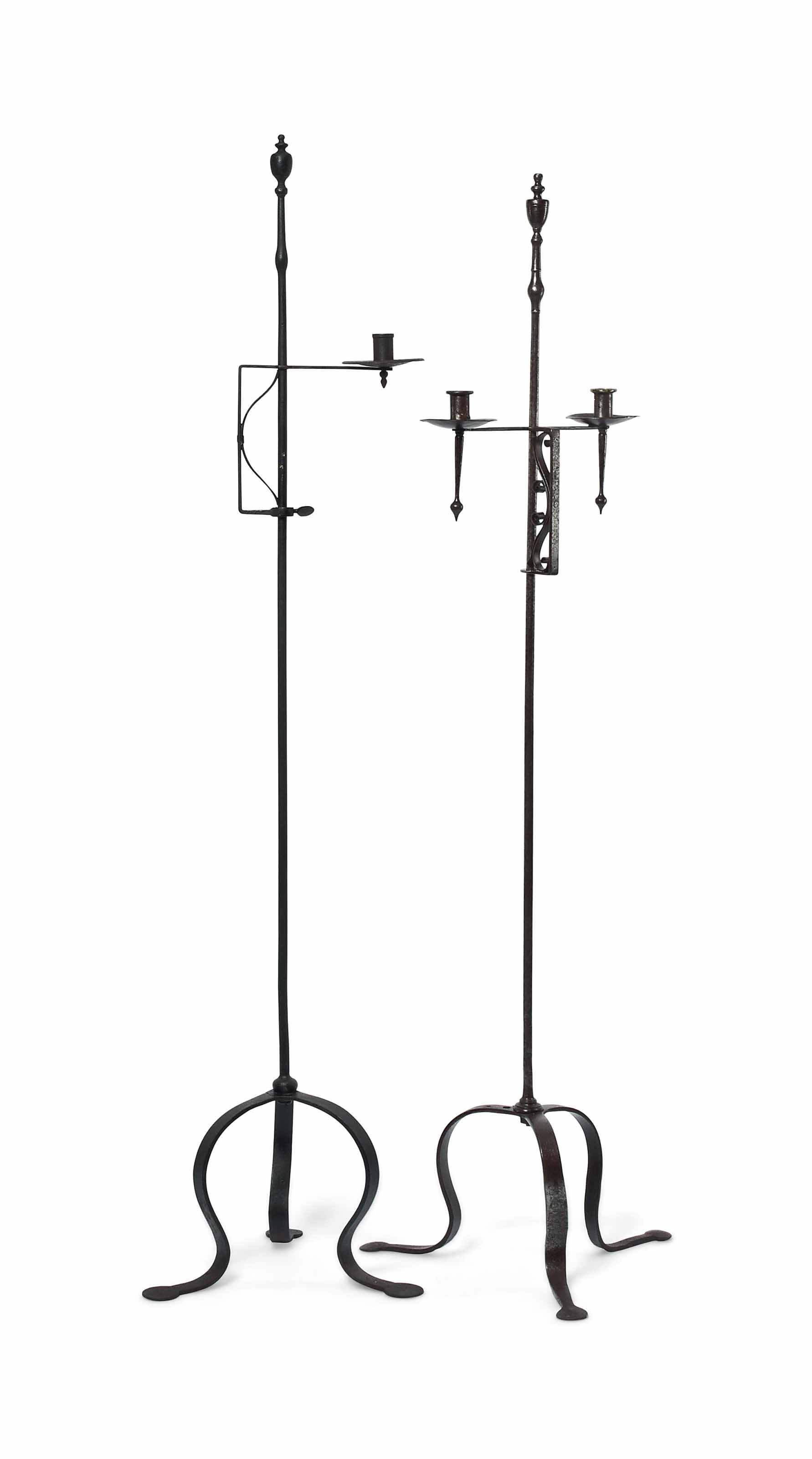 TWO SIMILAR WROUGHTIRON FLOORSTANDING CANDLEHOLDERS , ARTS AND