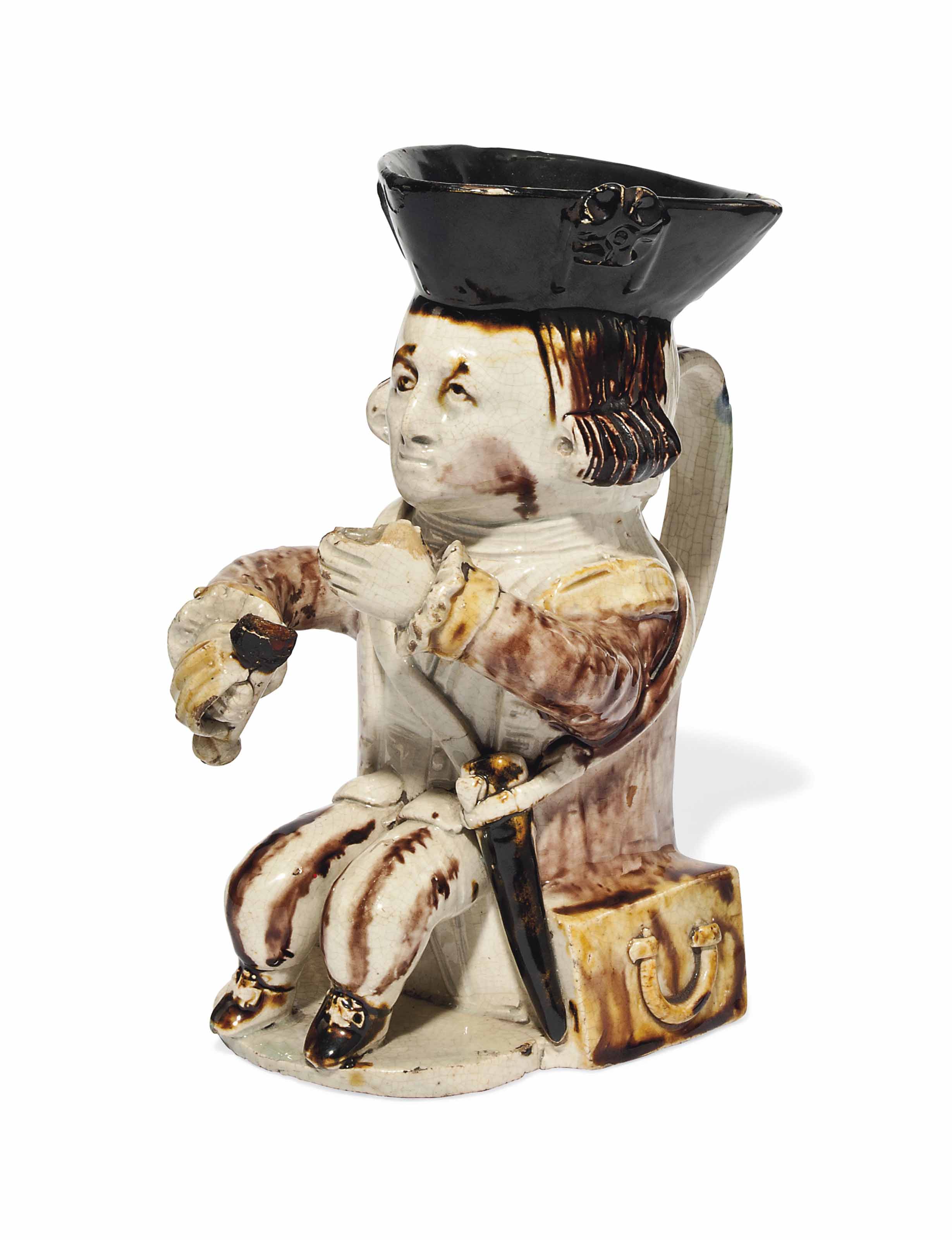 A STAFFORDSHIRE CREAMWARE 'MIDSHIPMAN' TOBY JUG , CIRCA 1770 Christie's