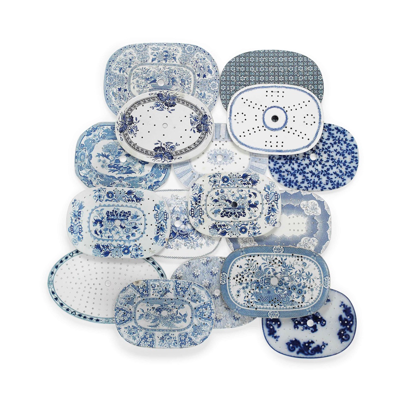 FIFTEEN ENGLISH POTTERY BLUE AND WHITE PRINTED MEAT DRAINERS AND A