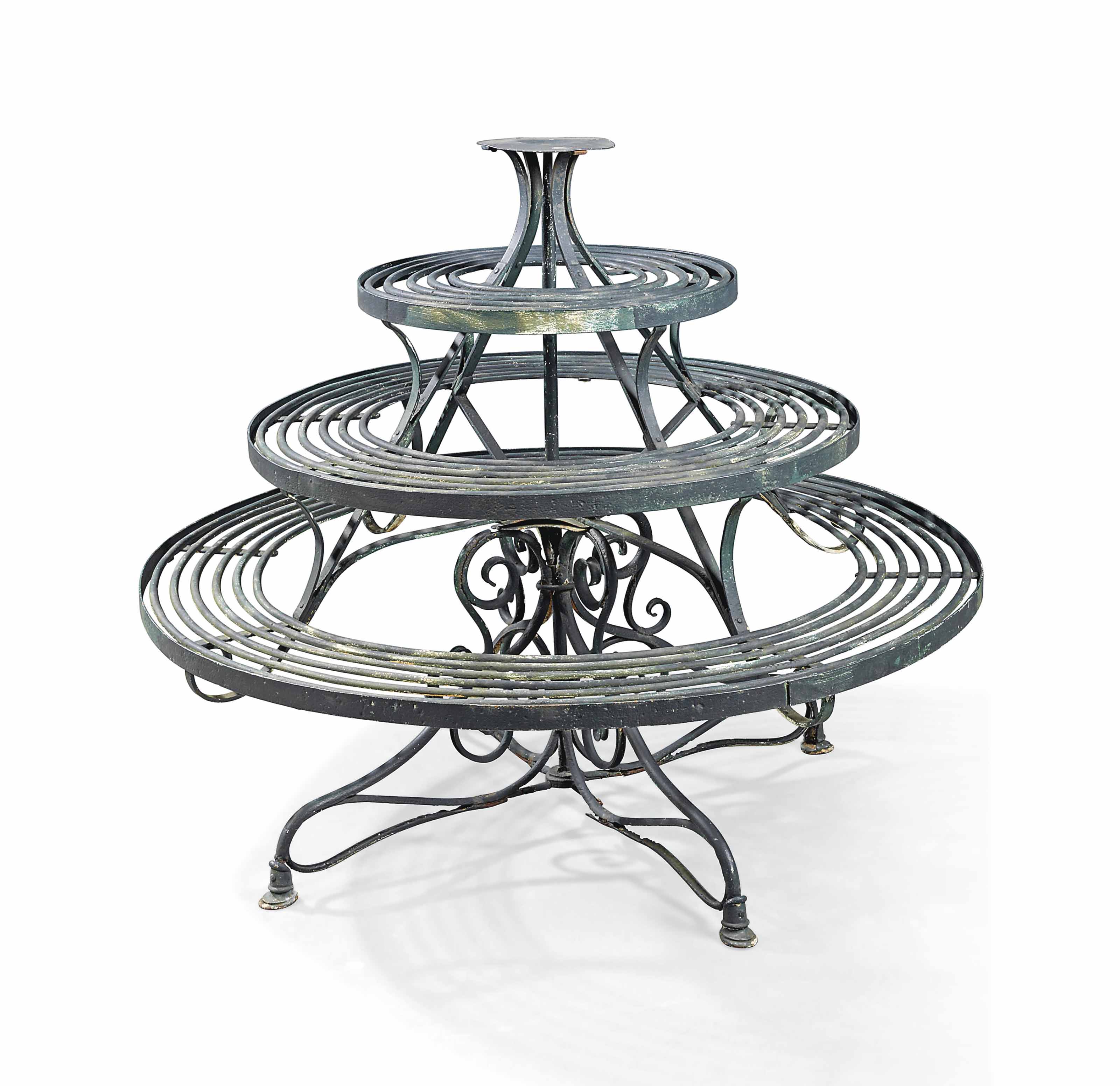 A VICTORIAN PAINTED WROUGHT-IRON REVOLVING PLANT-STAND ...