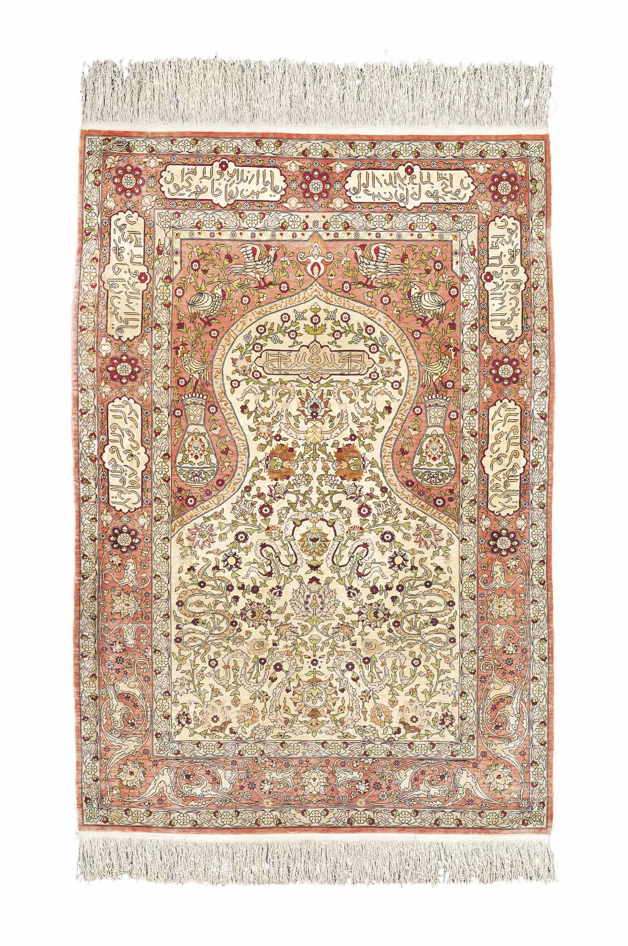 An extremely fine silk Hereke prayer rug Christie's