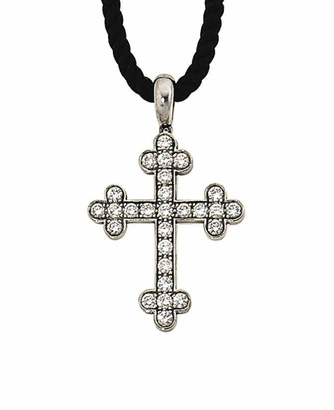 A diamond cross pendant, by Van Cleef 