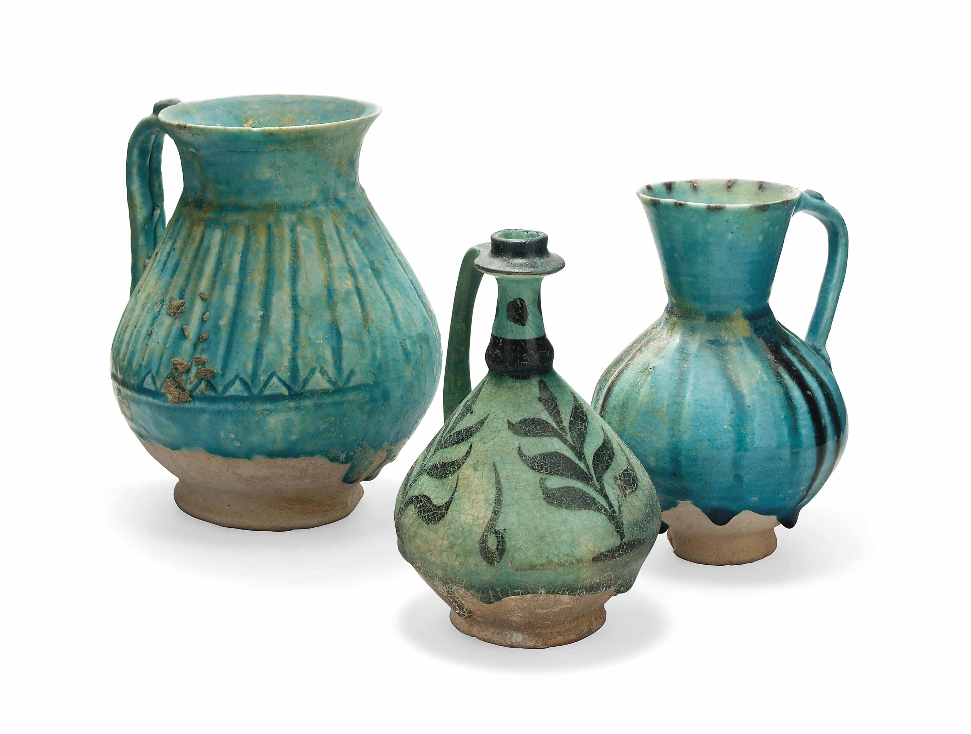 THREE KASHAN TURQUOISEBLUE GLAZED POTTERY JUGS , CENTRAL IRAN, 12TH