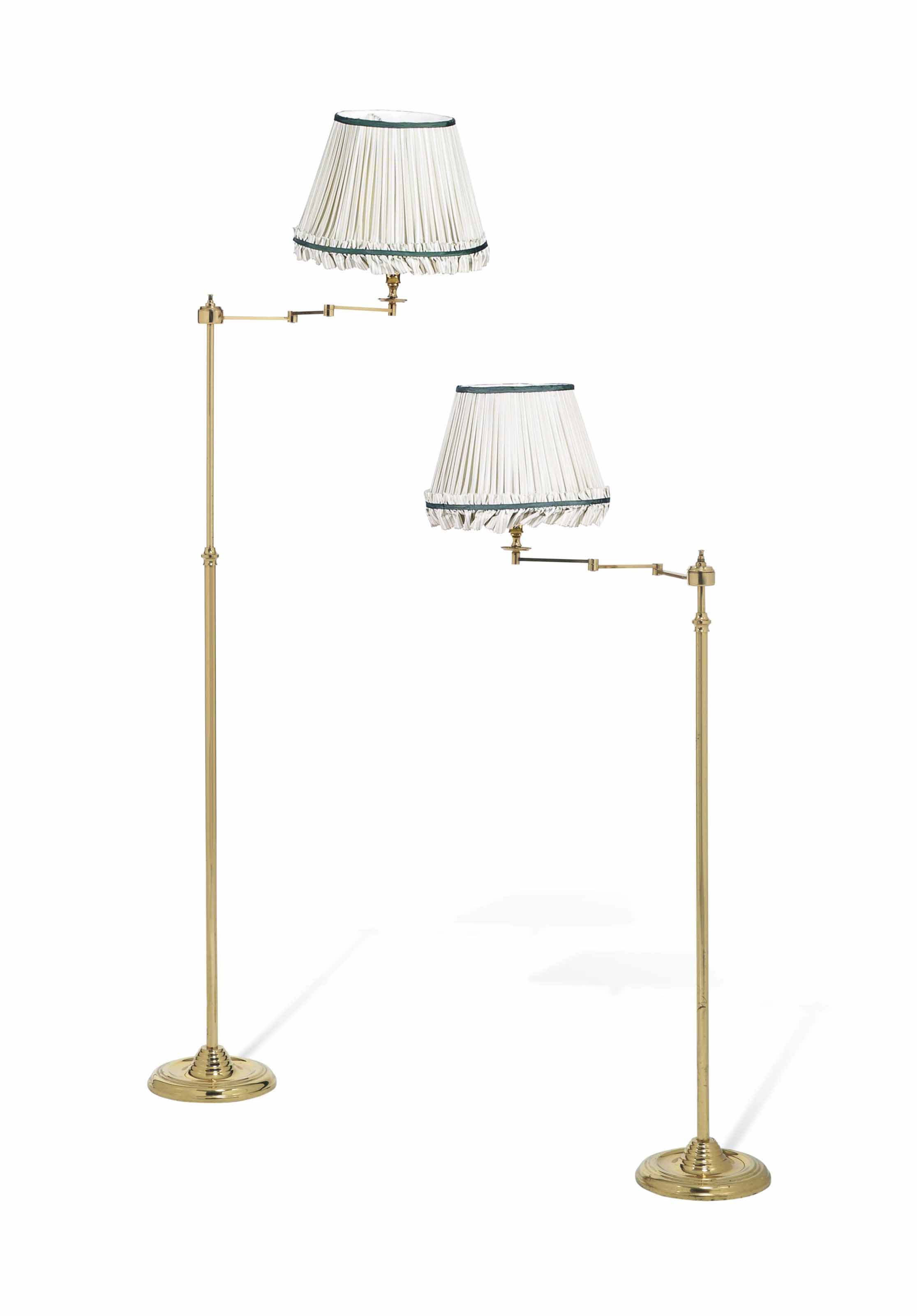 A PAIR OF FRENCH BRASS ARTICULATED FLOORSTANDING READINGLAMPS