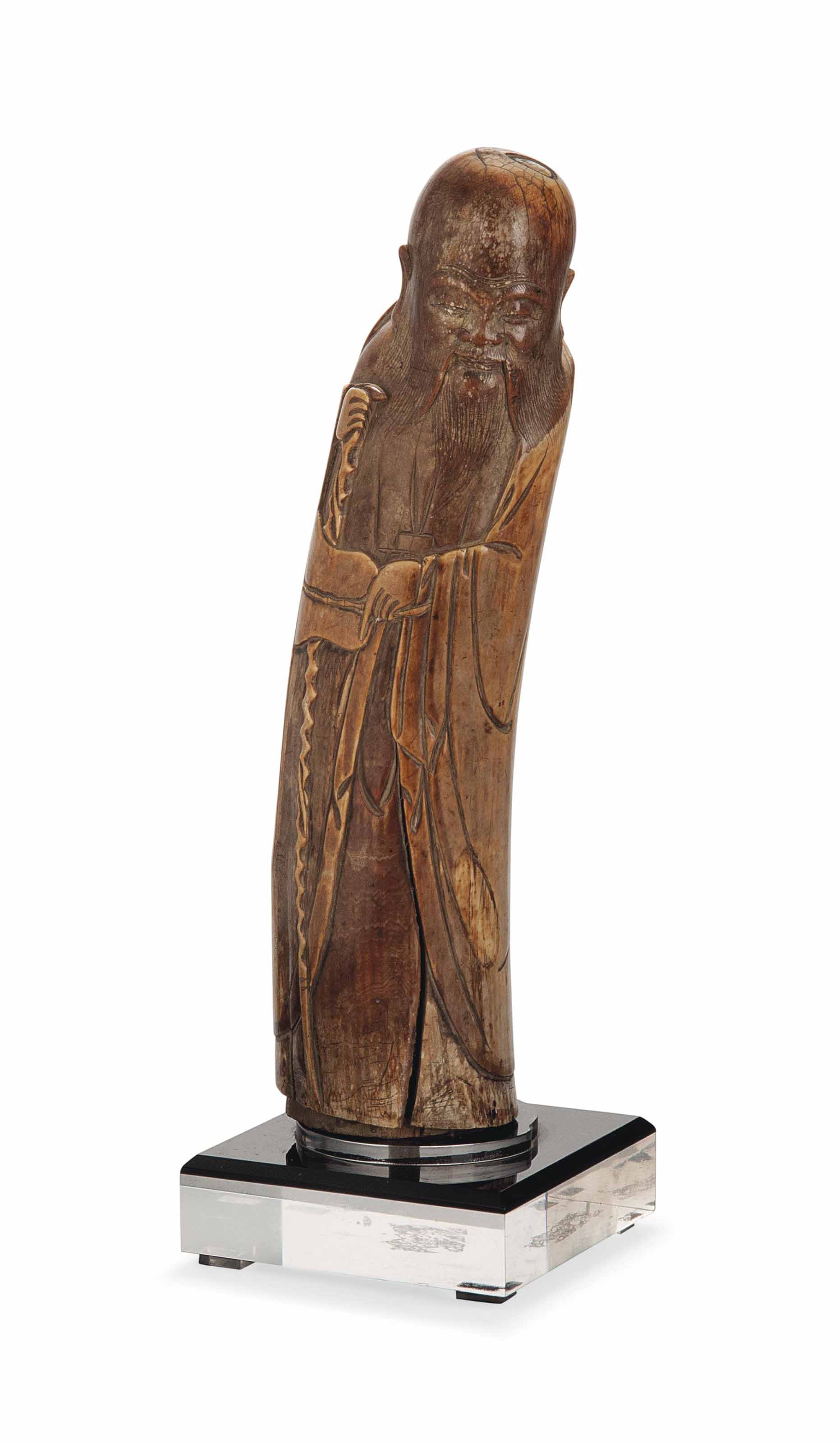 A CHINESE IVORY CARVING OF ZHONGLI QUAN , MING DYNASTY, 17TH CENTURY