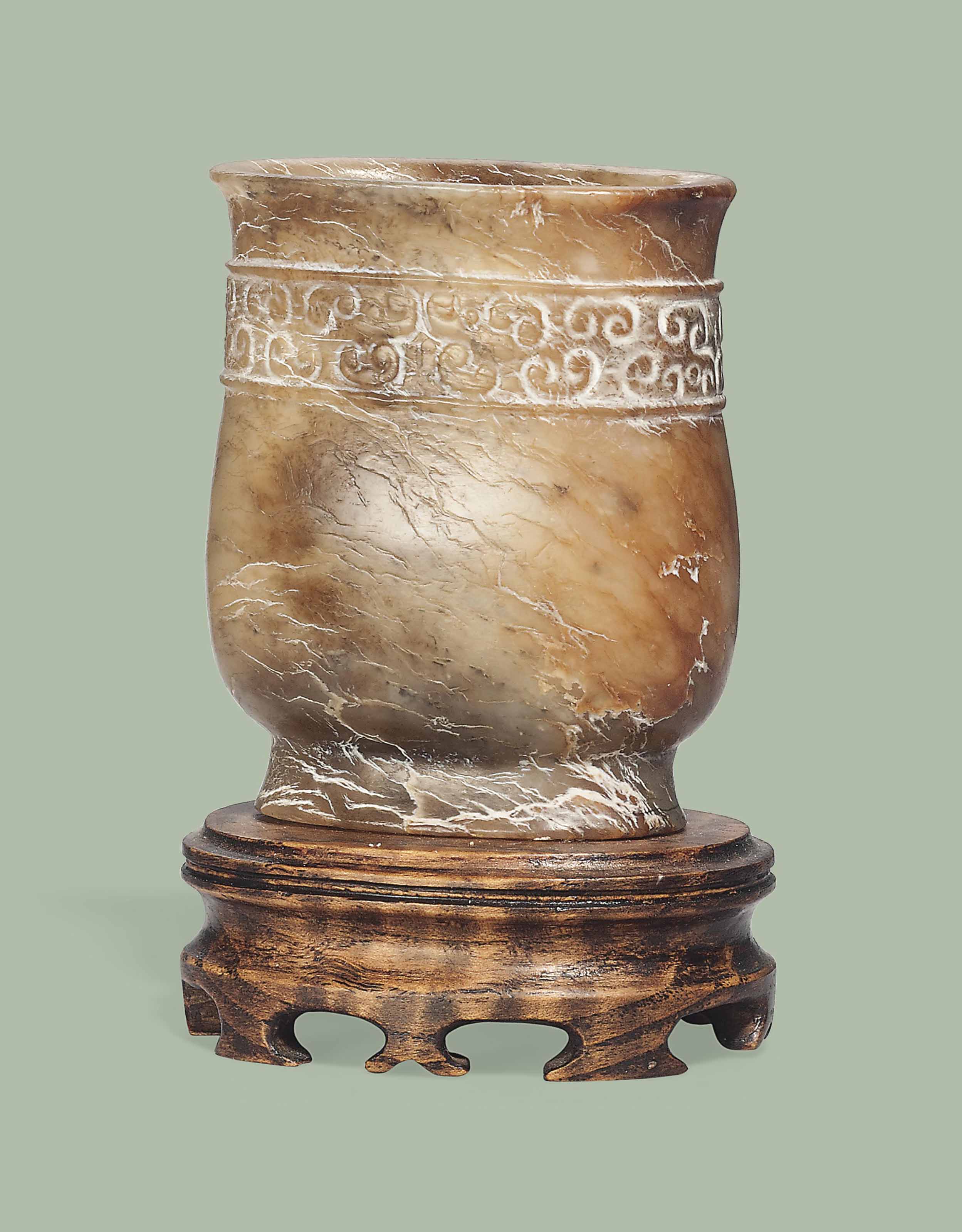 A SMALL MOTTLED BROWN JADE VASE, ZHI , YUAN/MING DYNASTY (12601644