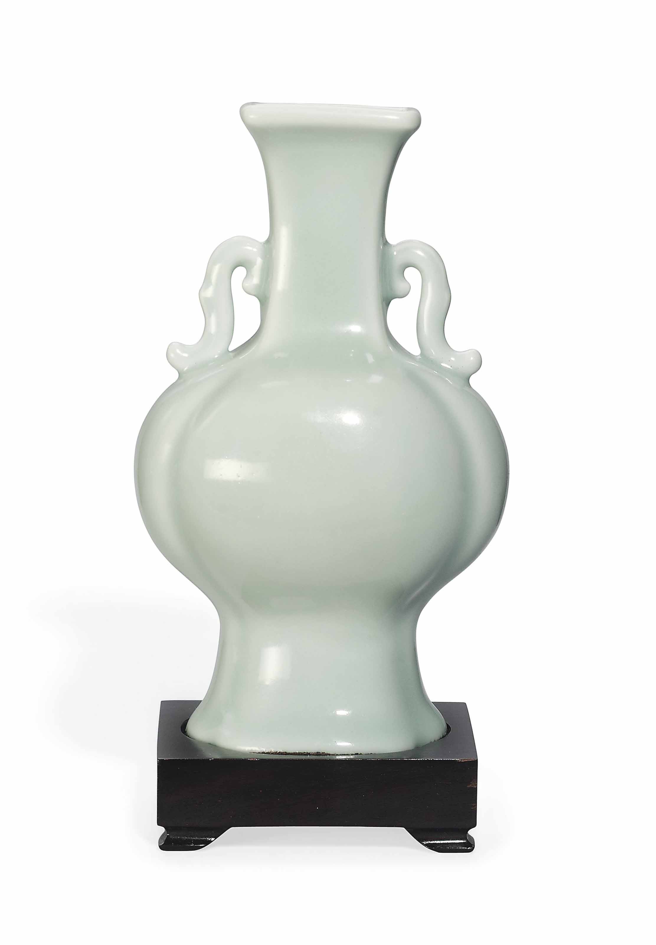 A CELADONGLAZED TWOHANDLED LOBED VASE , QIANLONG UNDERGLAZE BLUE FOUR