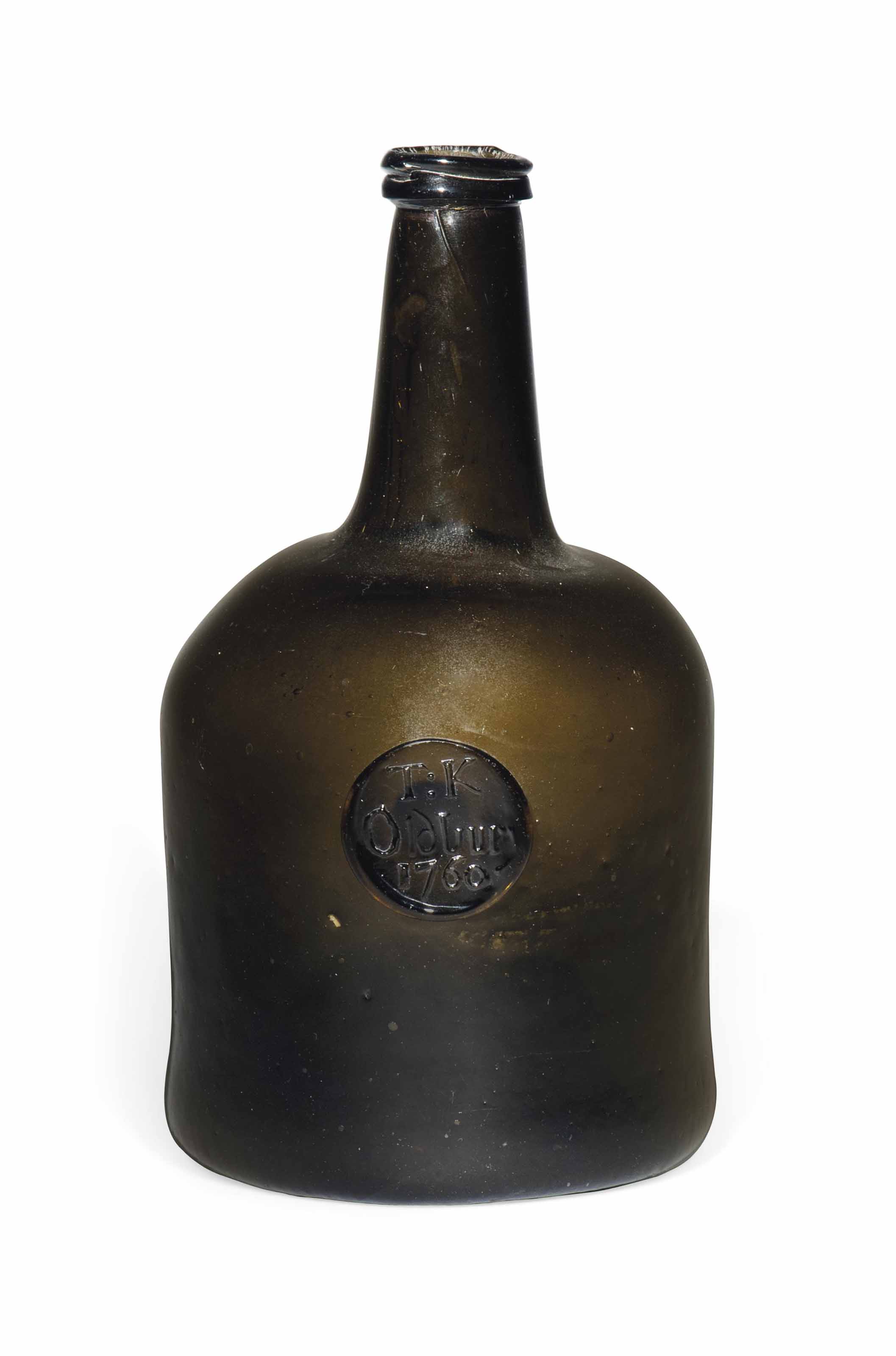 AN ENGLISH GLASS SEALED WINE BOTTLE , DATED 1760 Christie's