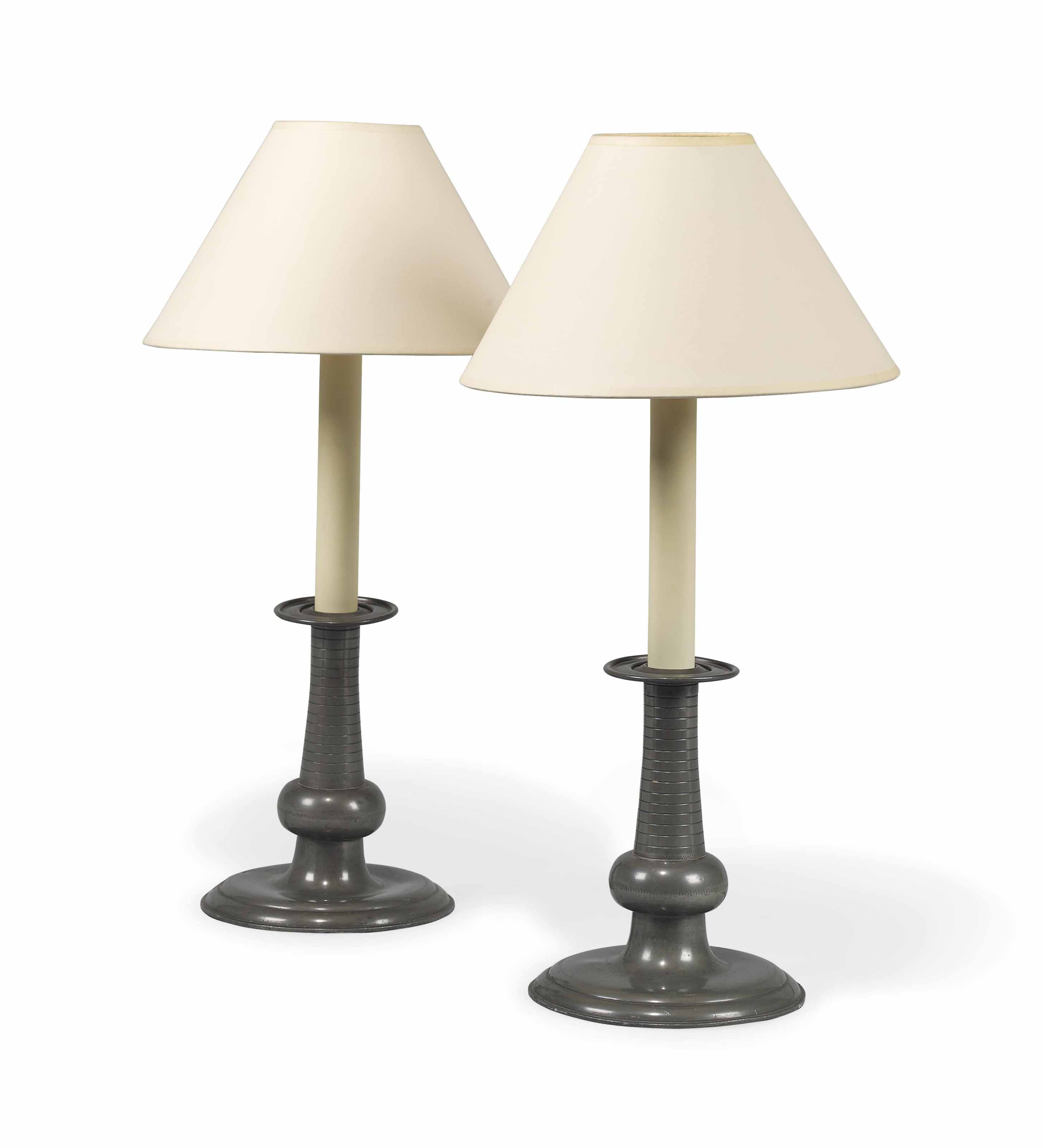 A PAIR OF PEWTER CANDLESTICK LAMPS , EARLY 20TH CENTURY, POSSIBLY SWEDISH AND RETAILED BY