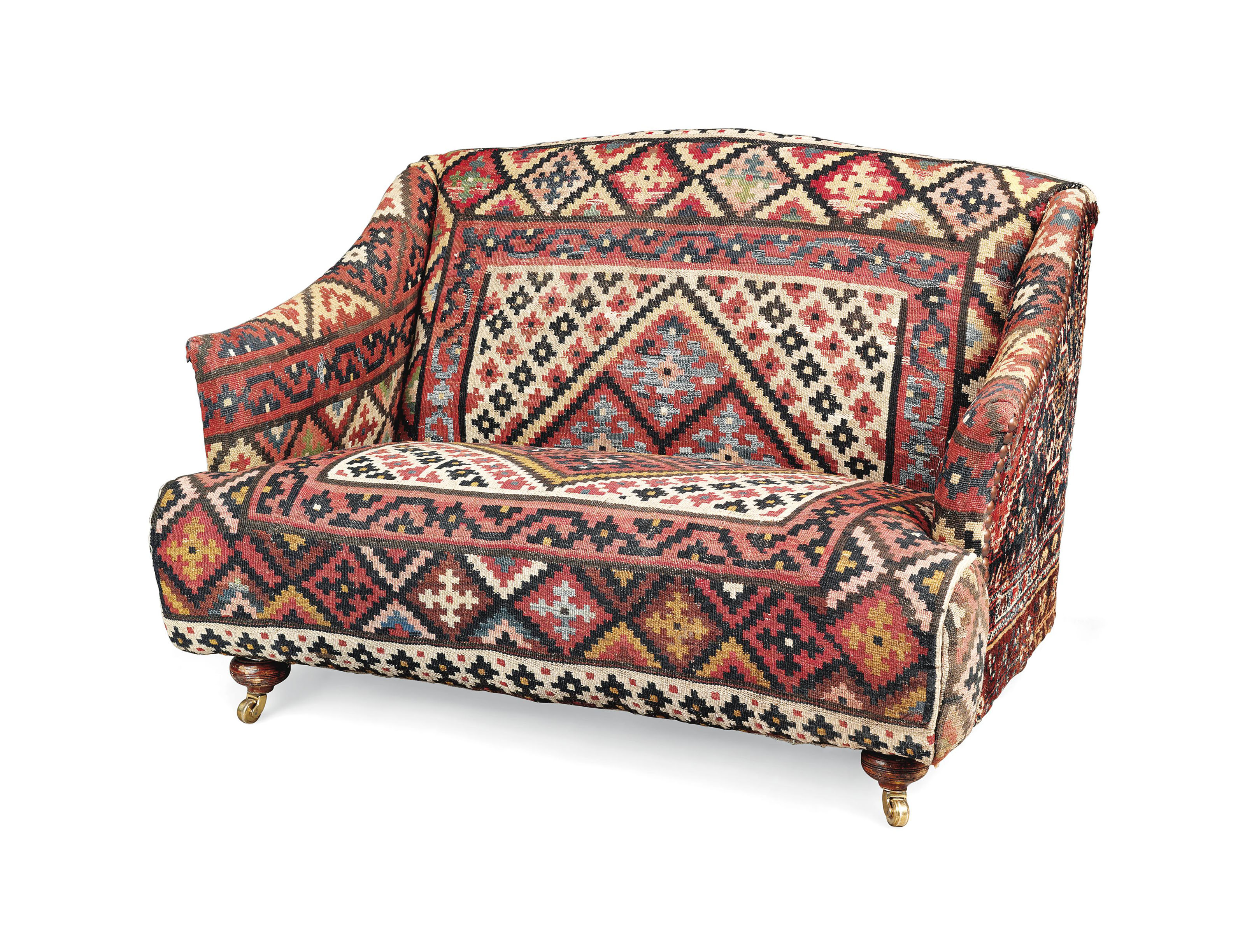 A KILIM UPHOLSTERED SOFA , OF RECENT MANUFACTURE, THE FEET CIRCA 1900