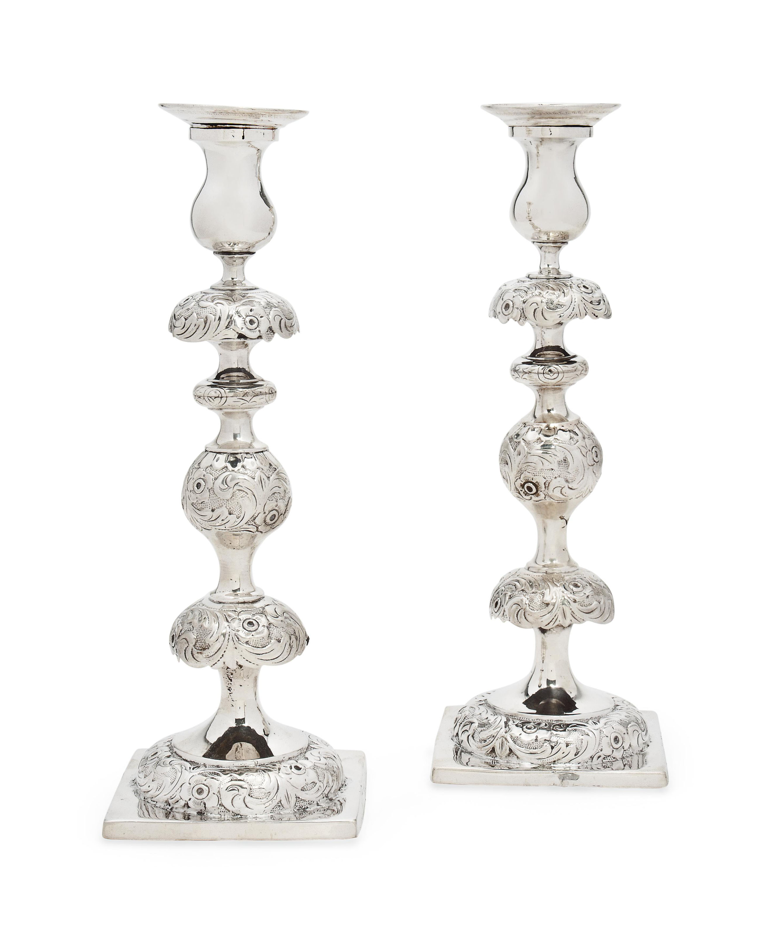 JUDAICA A PAIR OF POLISH SILVER SABBATH CANDLESTICKS , MARK OF REINER