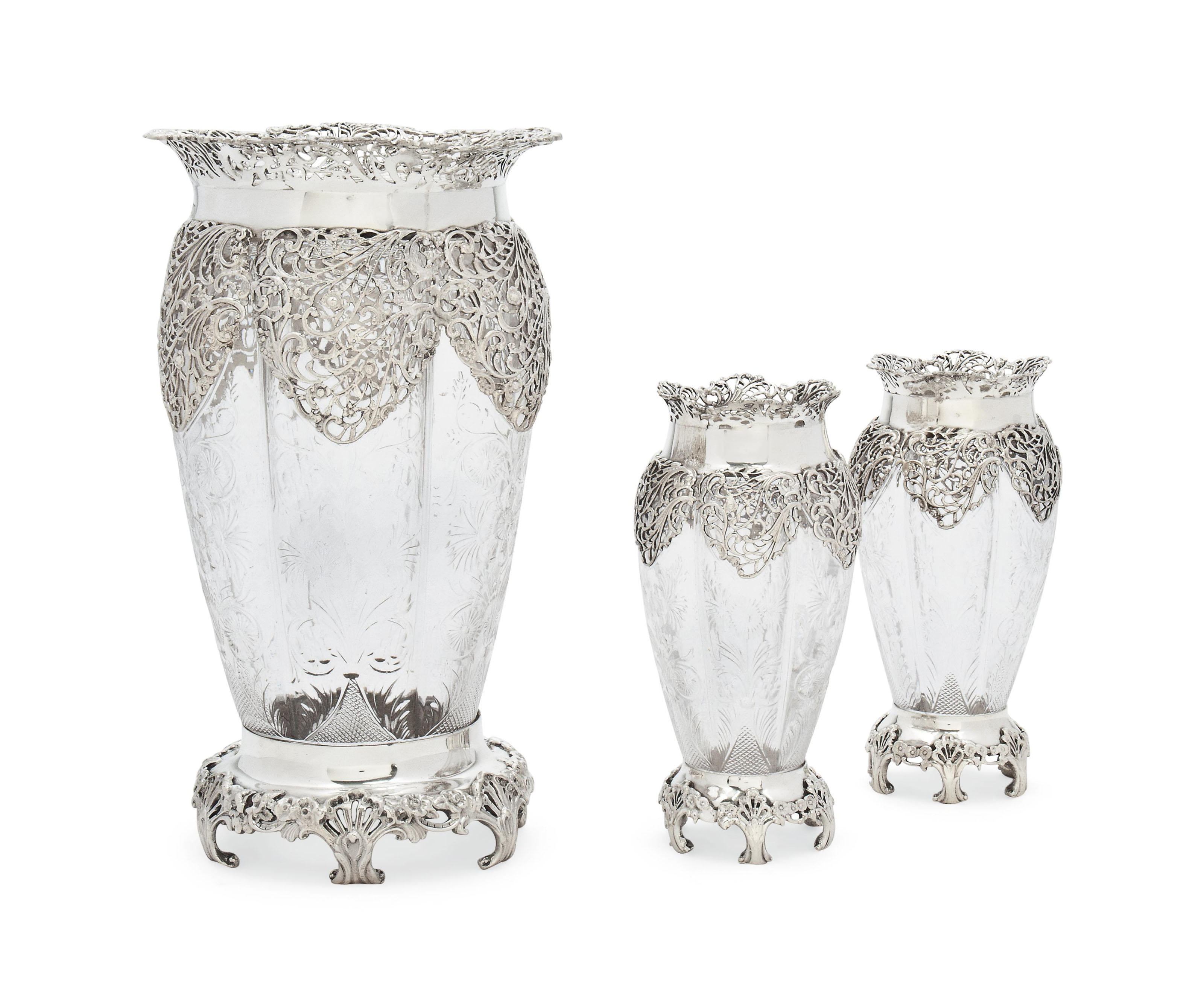 A MATCHED SET OF THREE EDWARDIAN SILVERMOUNTED GLASS VASES IN TWO