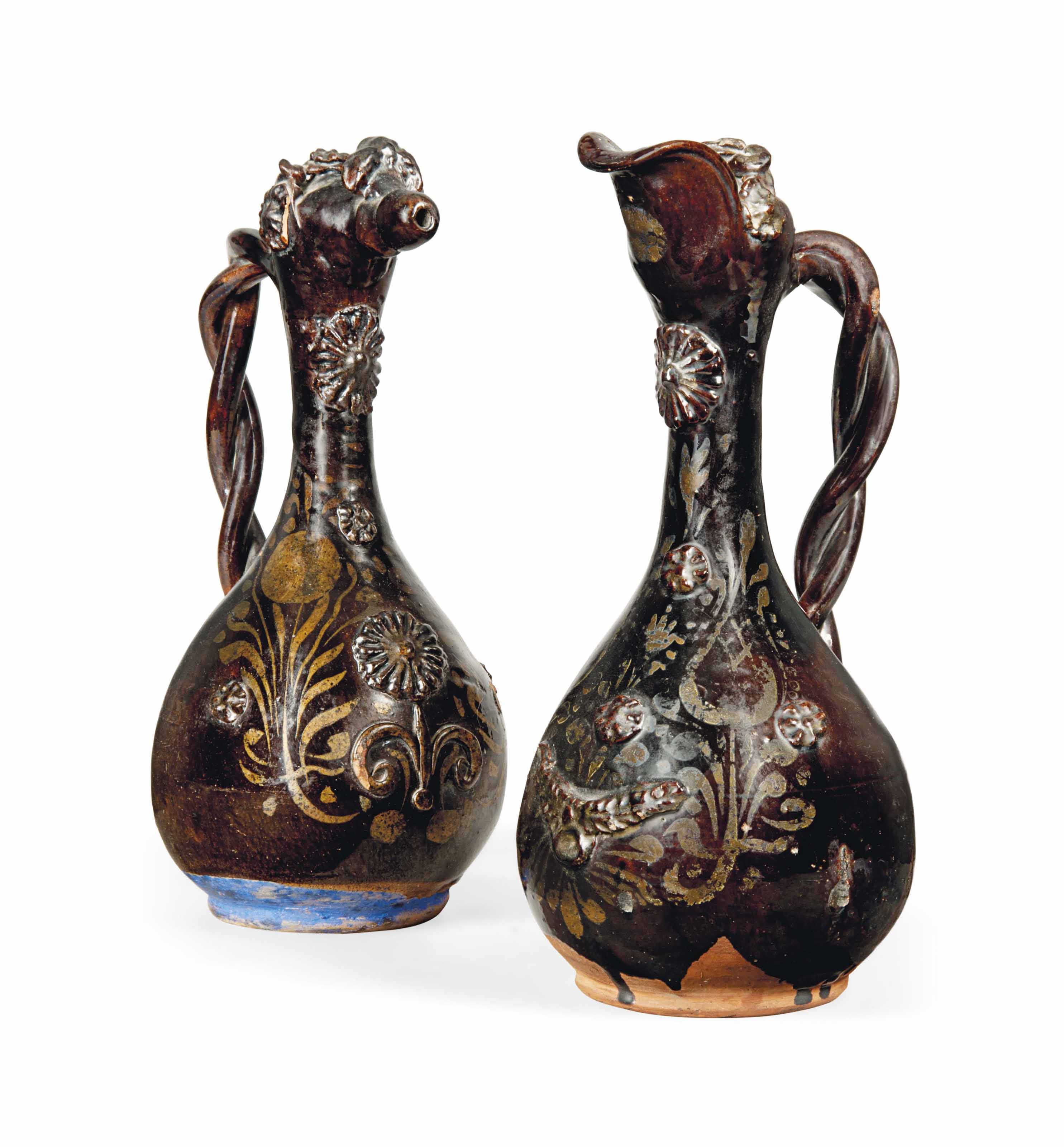 A PAIR OF TURKISH GLAZED EARTHENWARE WINE EWERS , CANNAKALE, 19TH