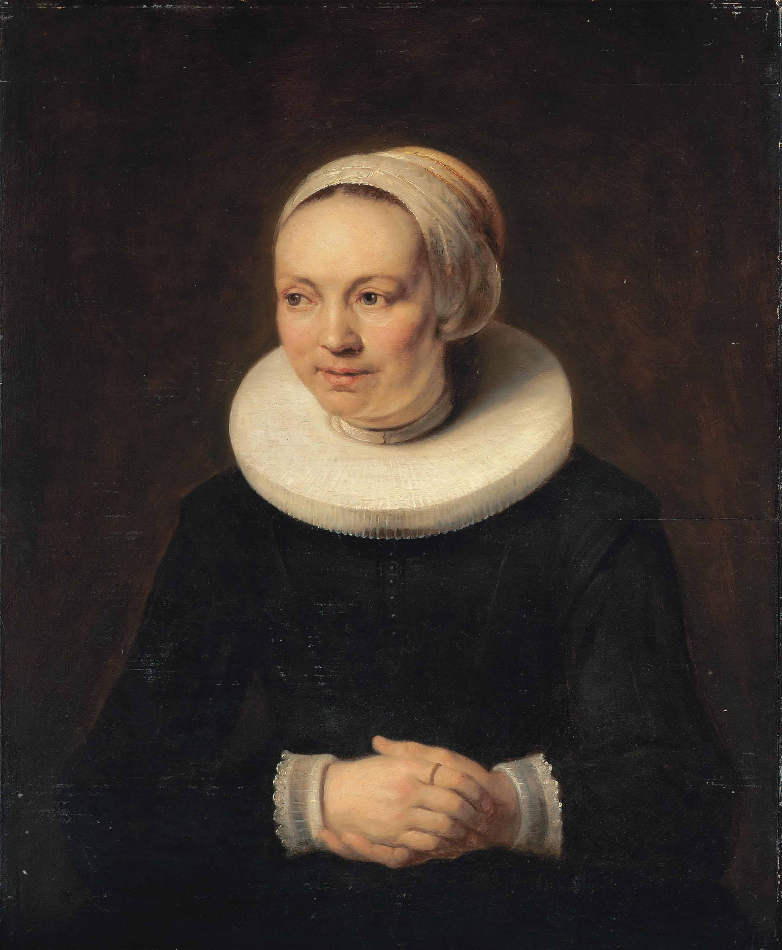 Portrait of a lady, half-length, in a black dress, with white ruff, lace cuffs and white headdress
