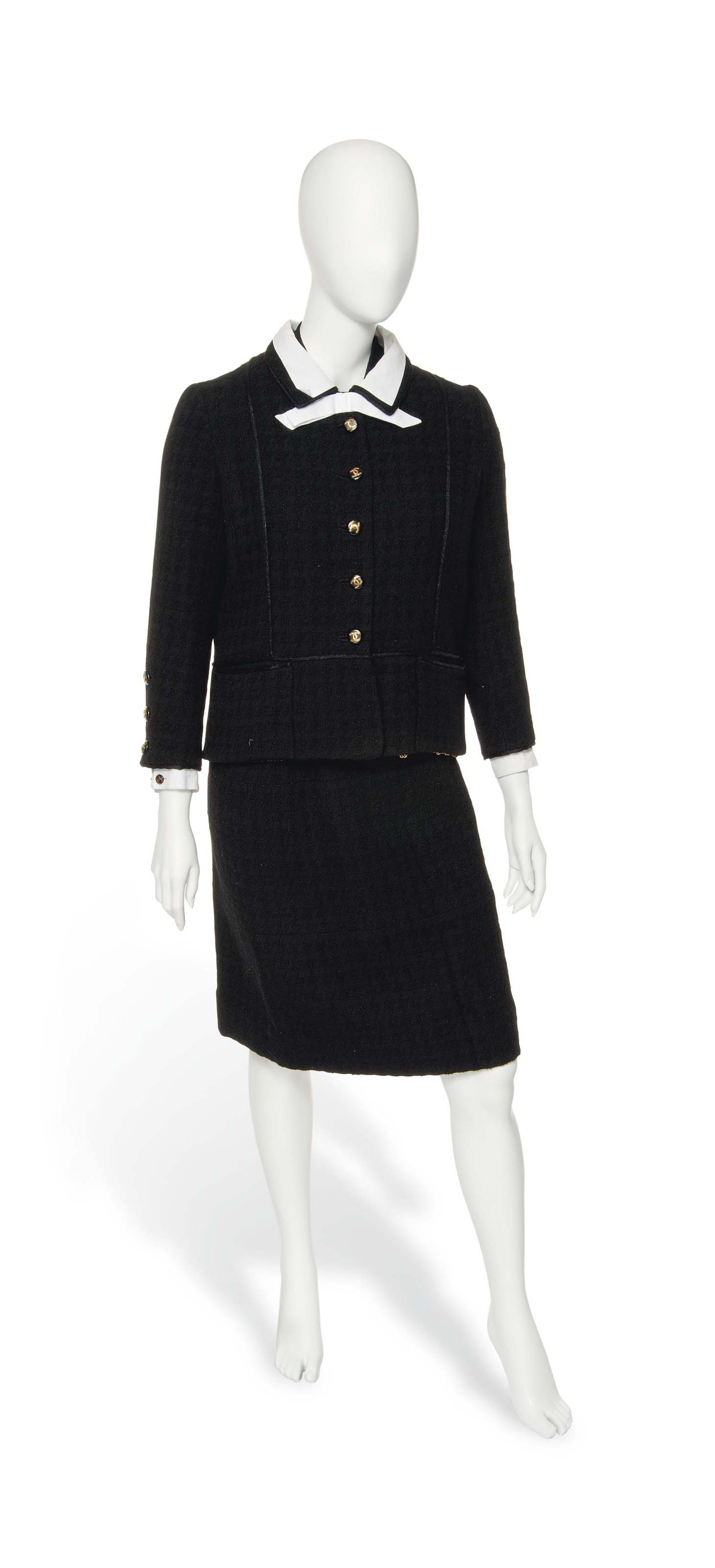 A CHANEL BLACK SKIRT SUIT AND BLOUSE
