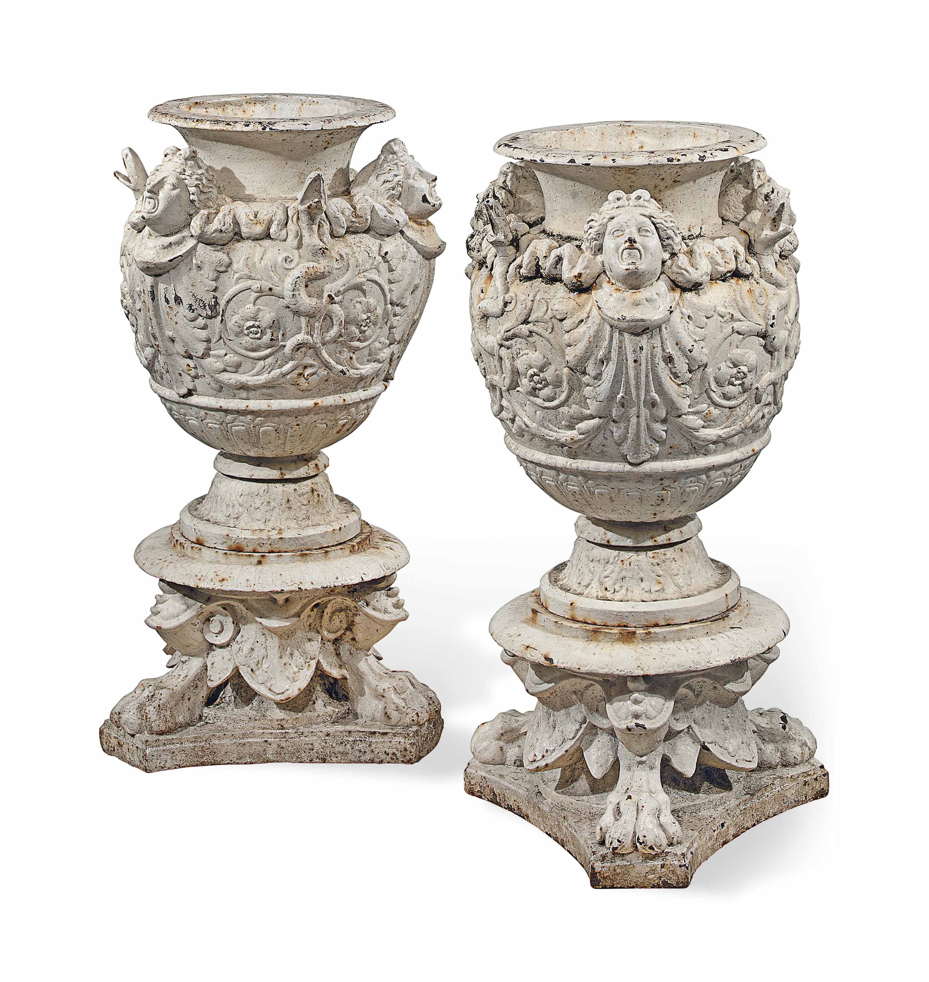 A PAIR OF FRENCH PAINTED CASTIRON URNS