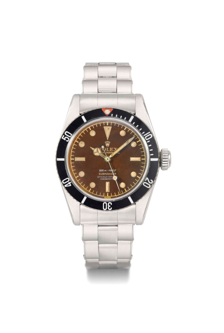 Rolex. A highly charismatic and extremely rare stainless steel automatic sweep centre seconds wristwatch with bracelet and brown-colored Four-Liner dial, signed Rolex, oyster perpetual, 200m=660ft, submariner, ref. 6538, case no. 449170, circa 1959. 37  mm  diam. Sold for CHF 519,750 on 13 May 2013 at Christie’s in Geneva