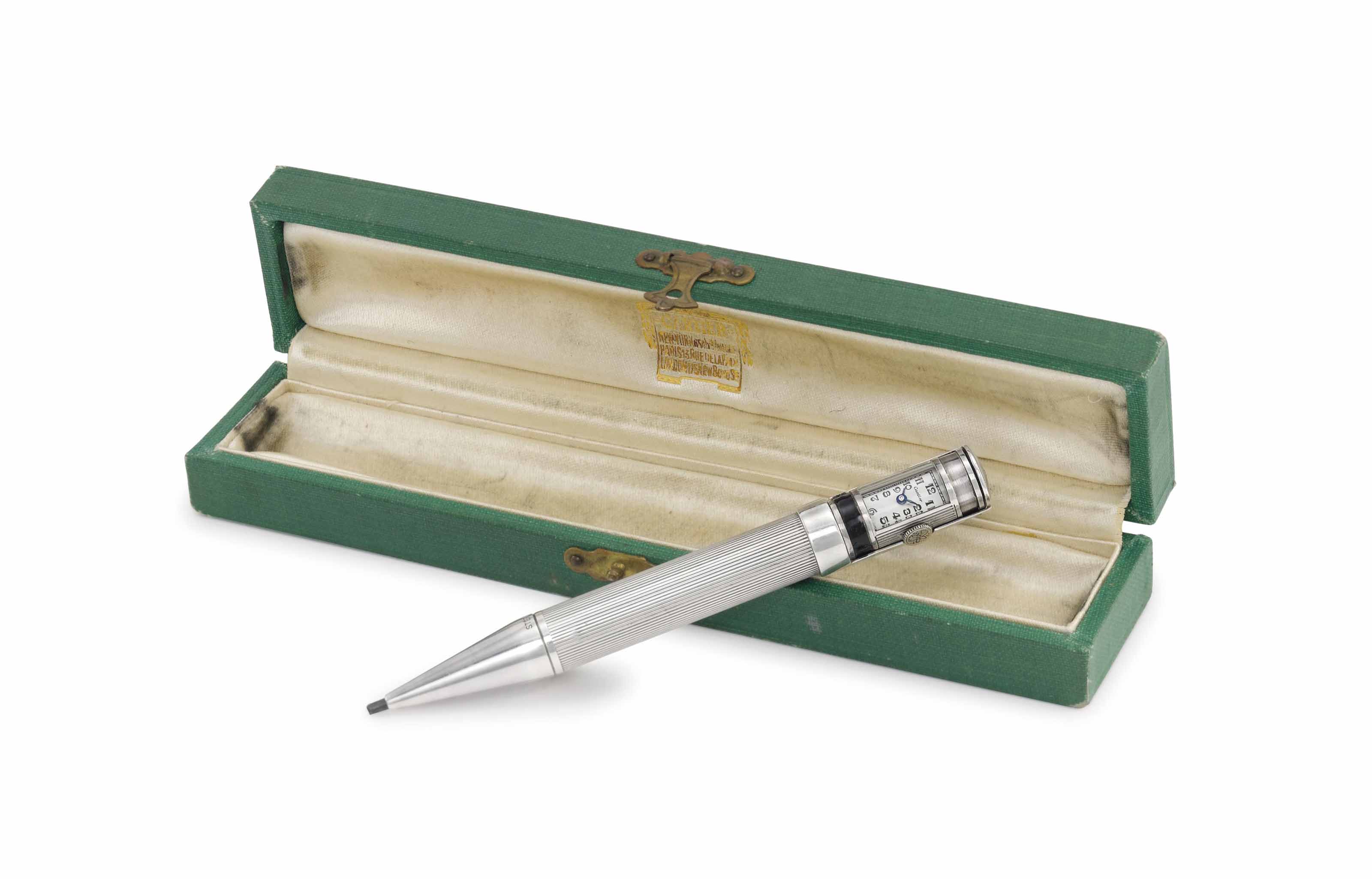 Cartier. A fine and rare sterling silver Art Deco pen with watch and