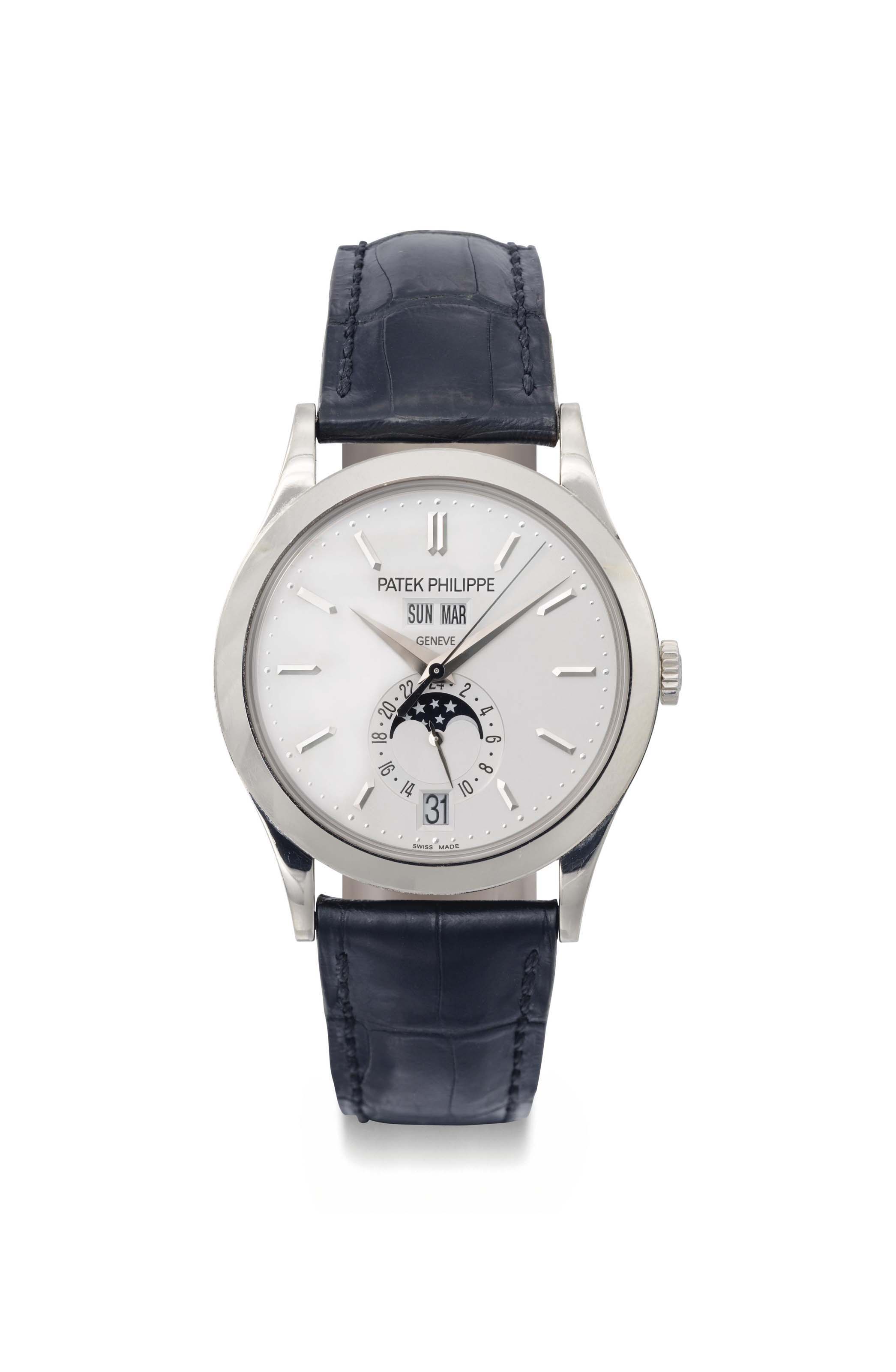 Patek Philippe. A very fine and very rare 18K gold perpetual 
