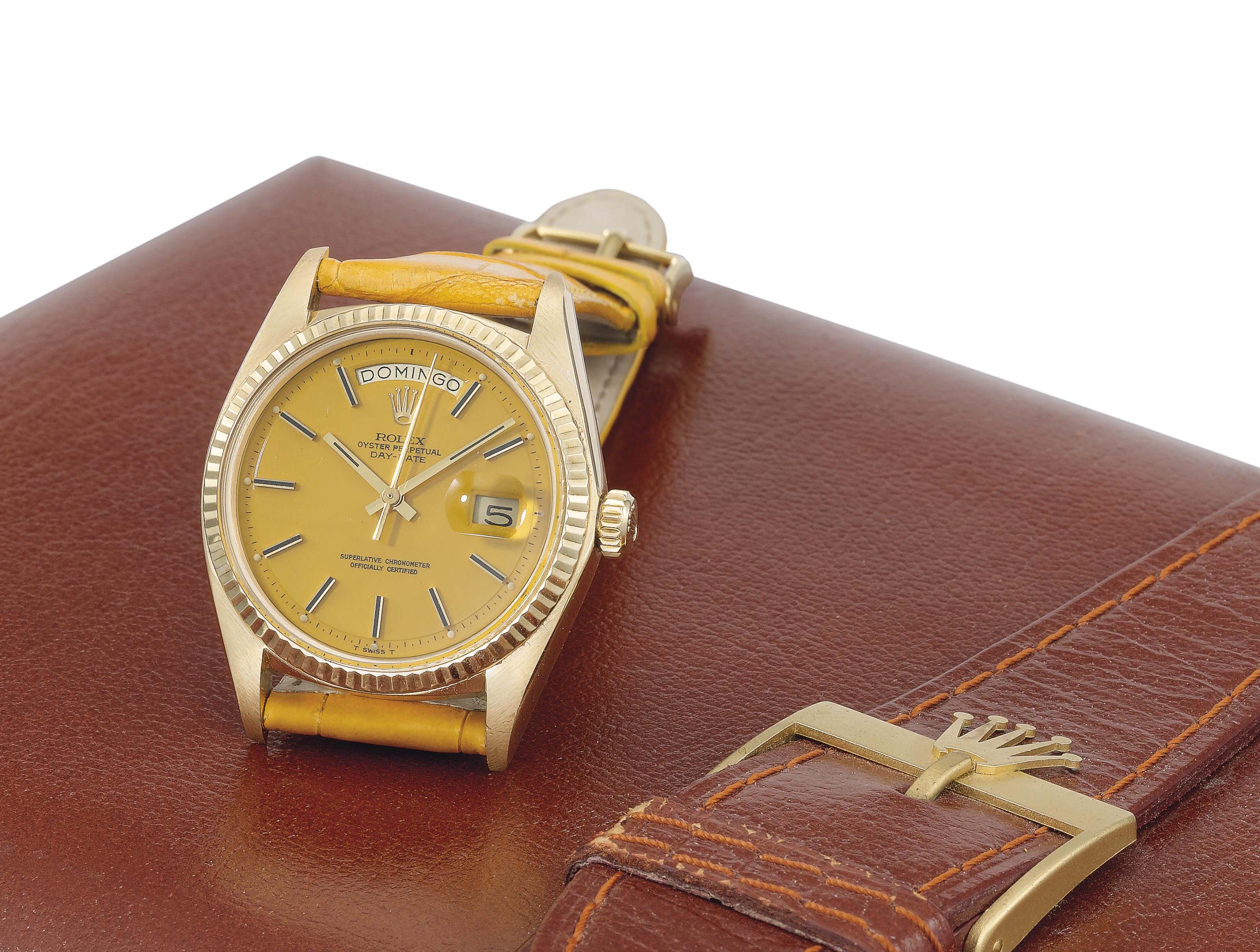 Rolex. An attractive 18K gold automatic calendar wristwatch with sweep