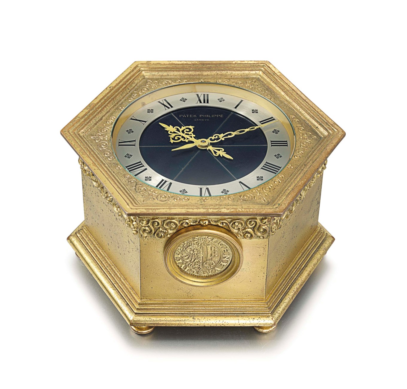Patek Philippe. A fine and rare, solar powered hexagonal gilt brass