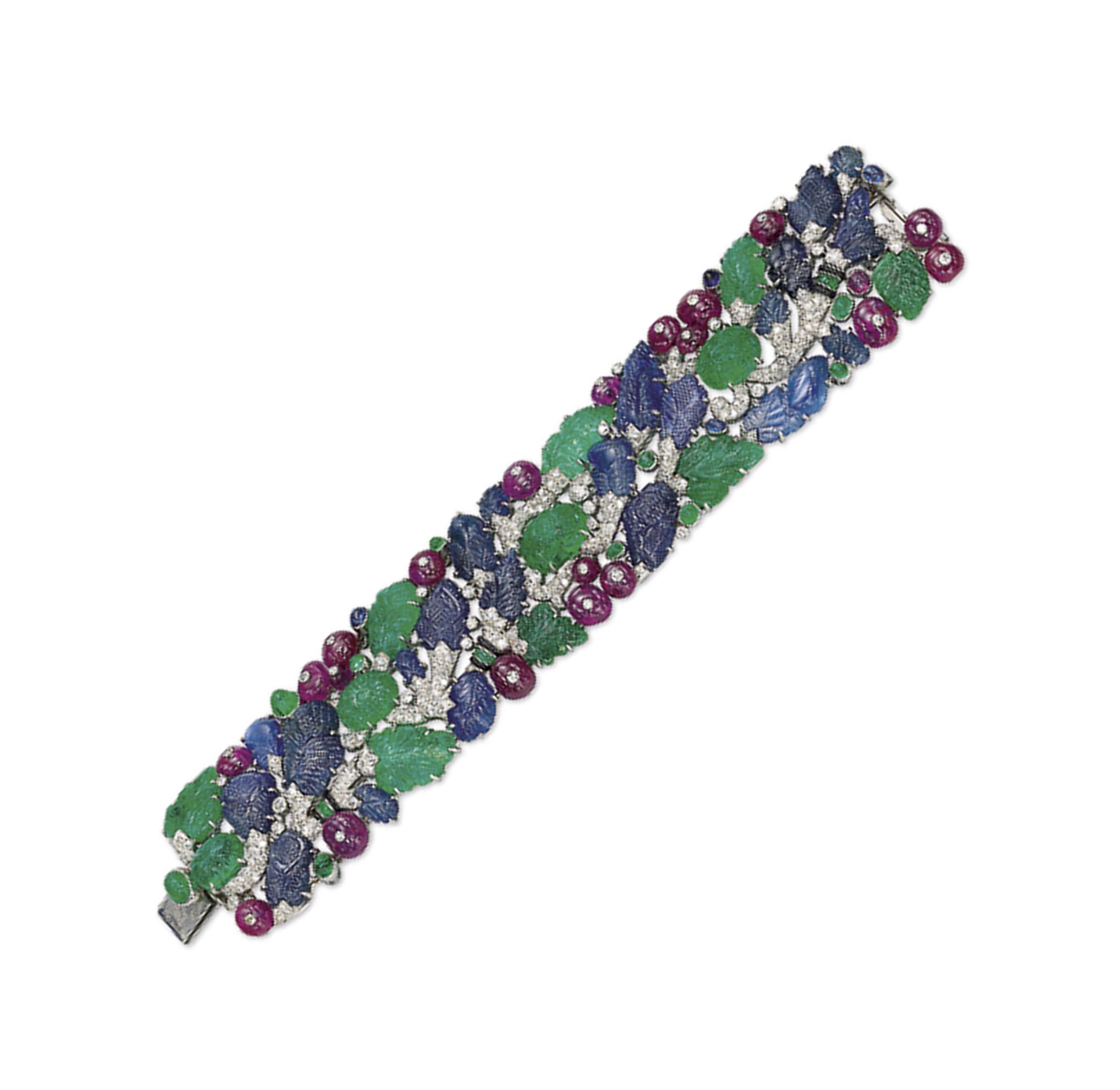 AN ART DECO DIAMOND AND MULTI GEM TUTTI FRUTTI BRACELET BY