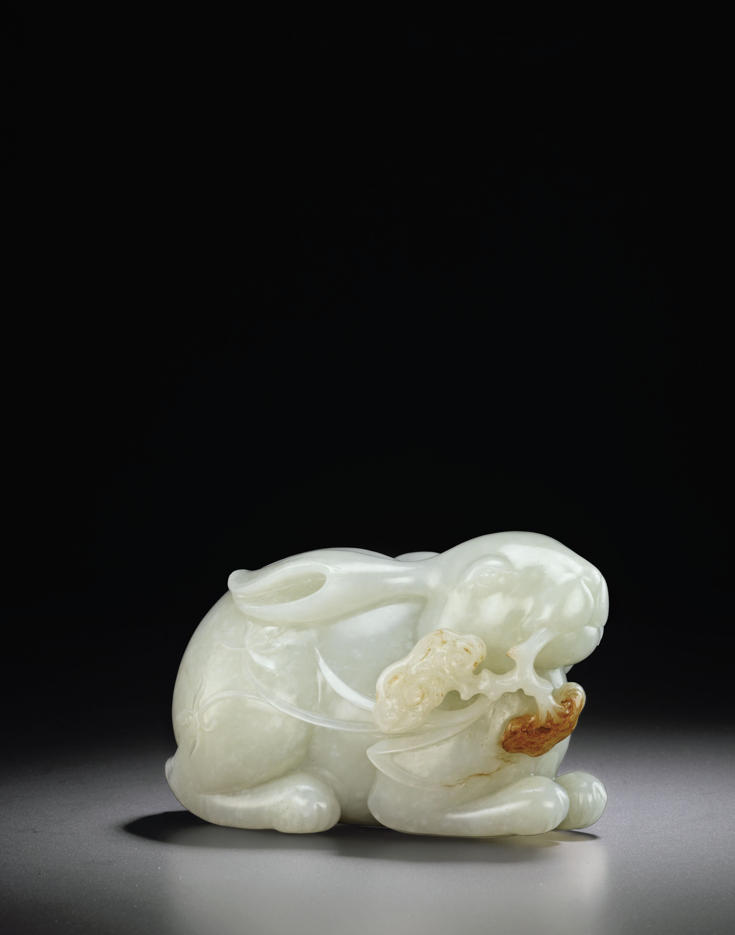 A LARGE WHITE JADE CARVING OF A RABBIT , QING DYNASTY, 18TH CENTURY