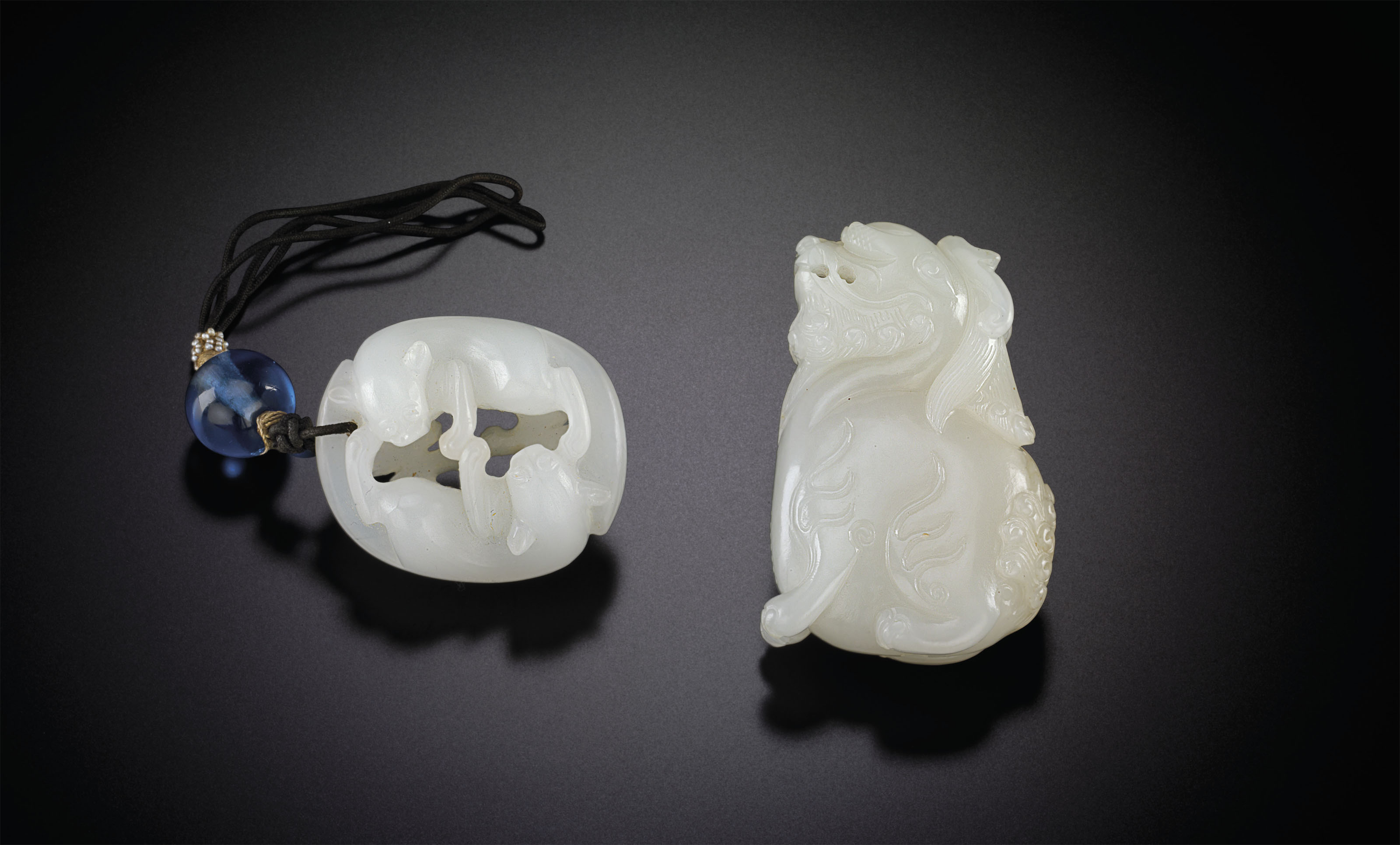 TWO WHITE JADE PENDANTS Christie's