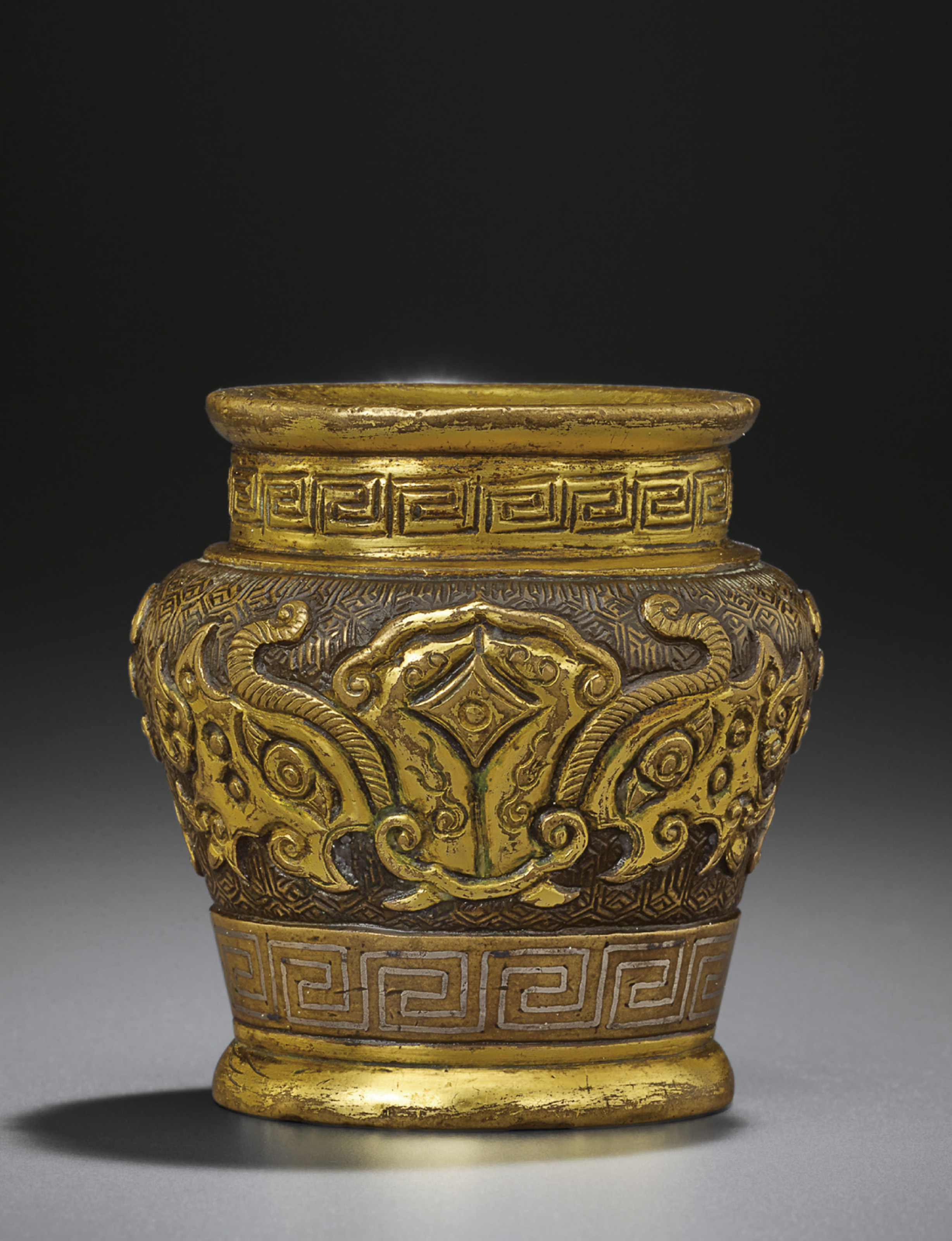A SMALL PARCELGILT BRONZE JAR , LATE MING DYNASTY, INCISED FOUR