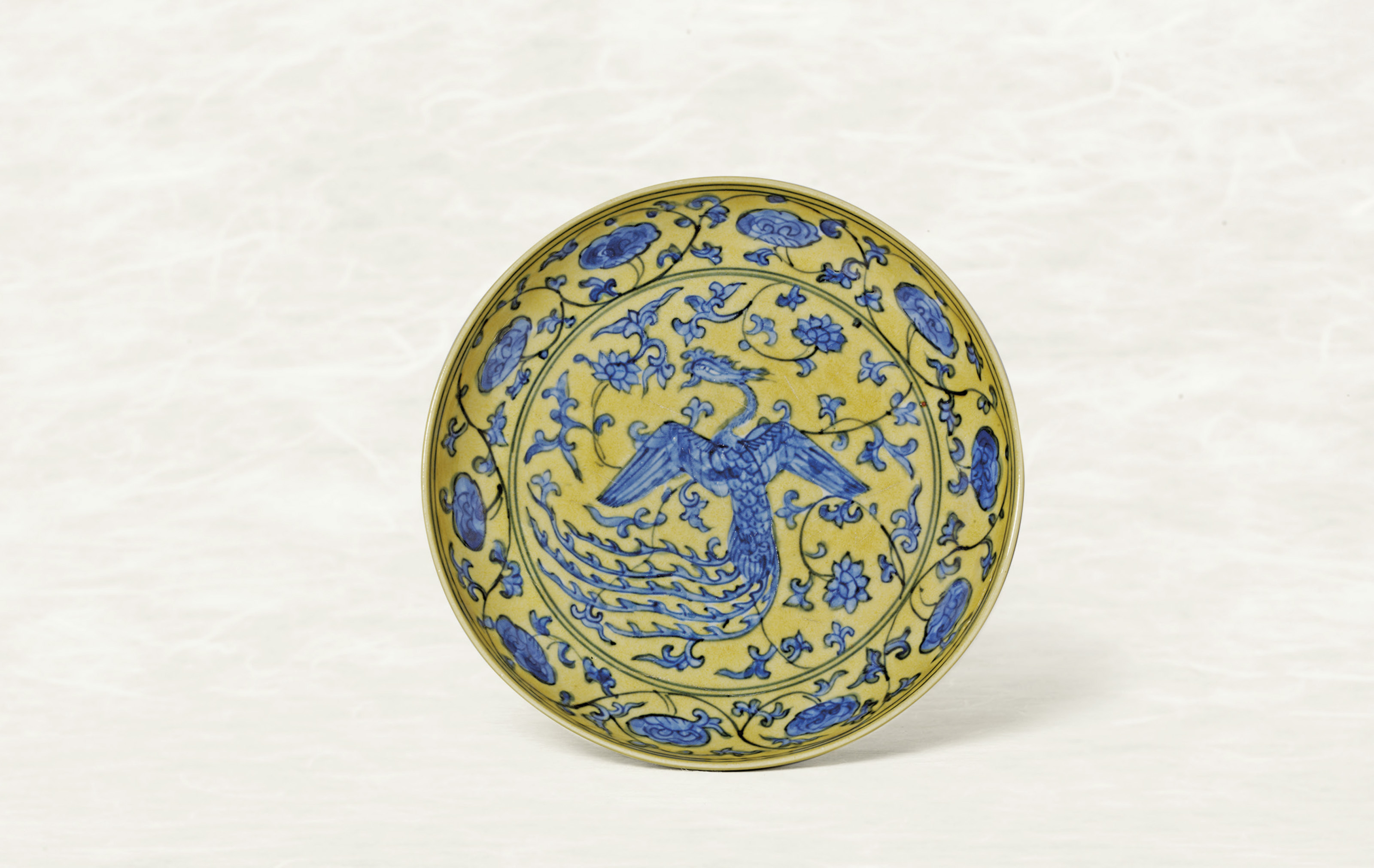 An Exceptionally Rare Yellow Ground Blue And White Phoenix Dish