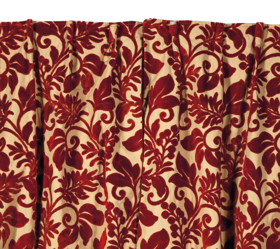 A PAIR OF CREAMGROUND CRIMSON CUT VELVET DRAPERY PANELS,
