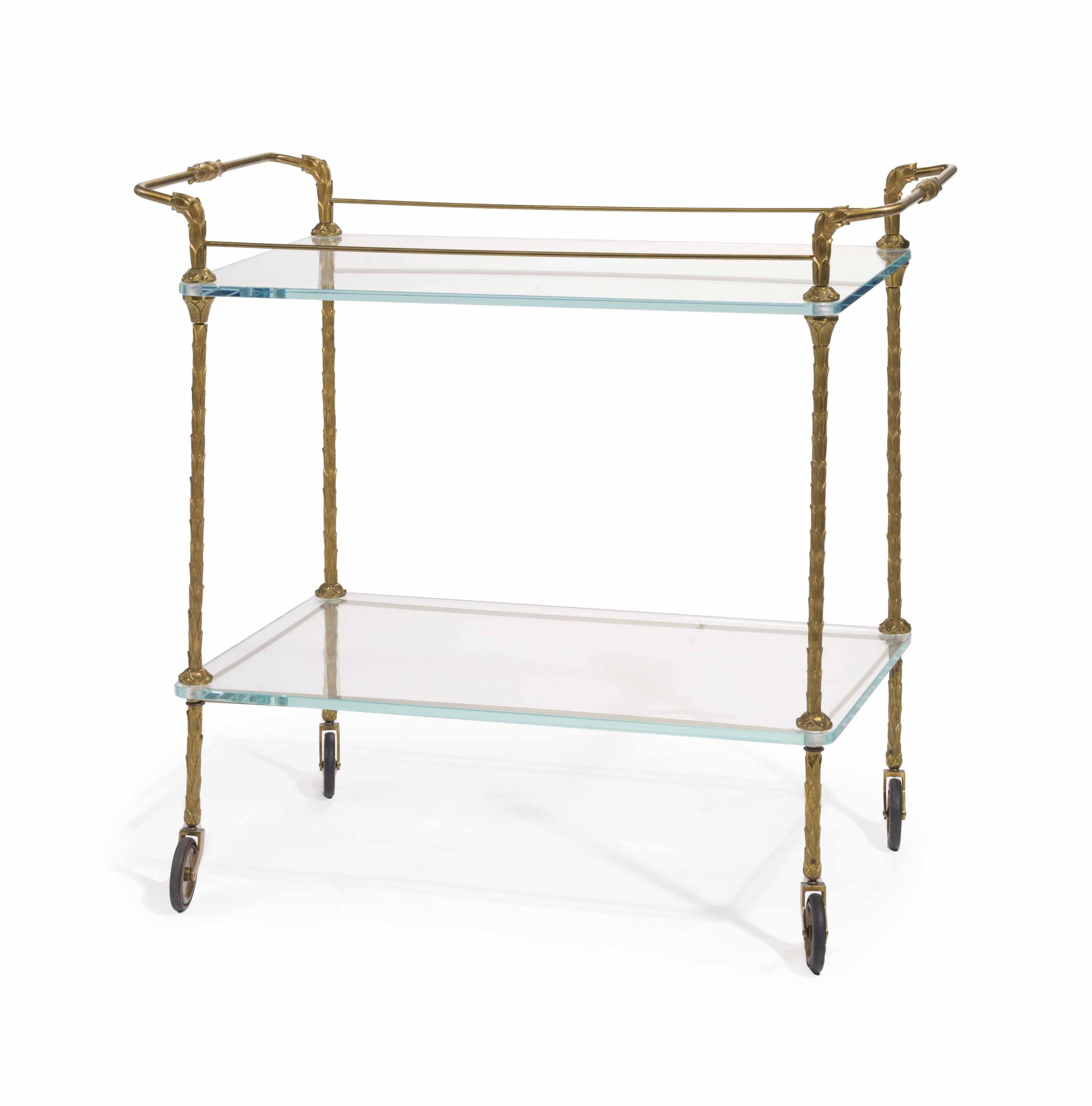 A FRENCH BRASS AND GLASS TWO-TIER DRINKS TROLLEY, , MID 20TH CENTURY | Christies A FRENCH BRASS AND GLASS TWO-TIER DRINKS... 
