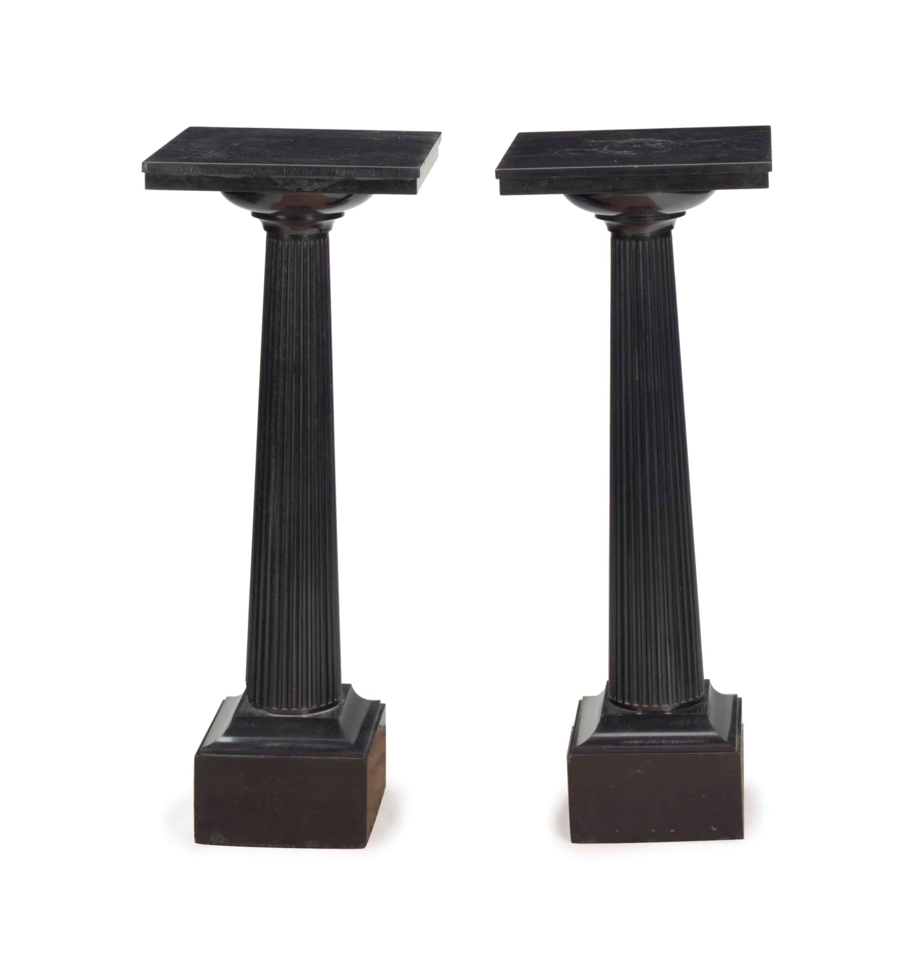 A PAIR OF BLACK MARBLE COLUMNARFORM PEDESTALS,