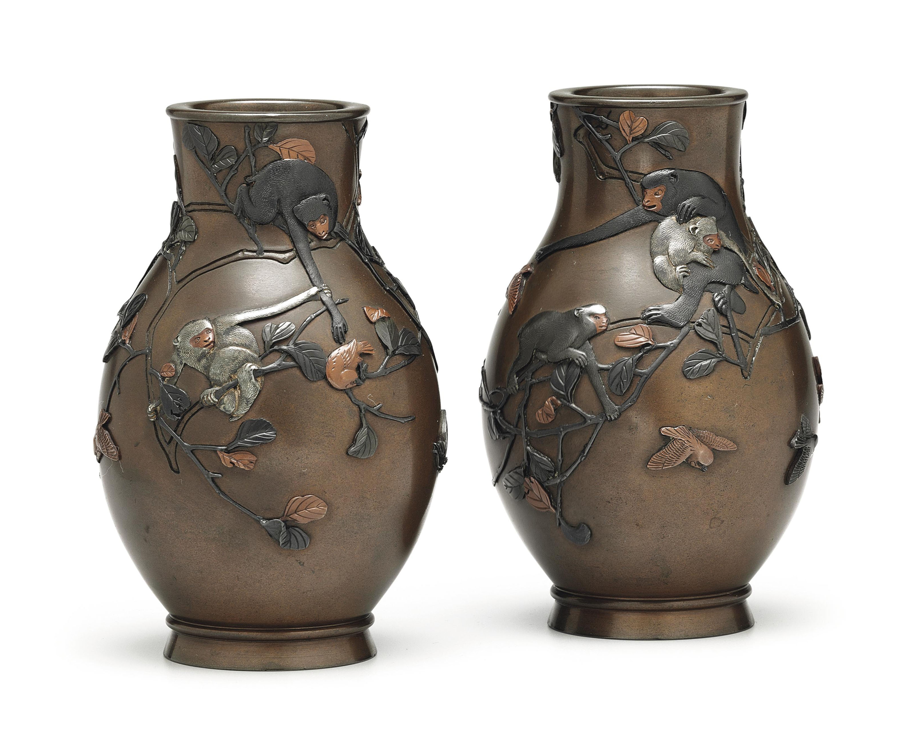 A pair of softmetaldecorated bronze vases