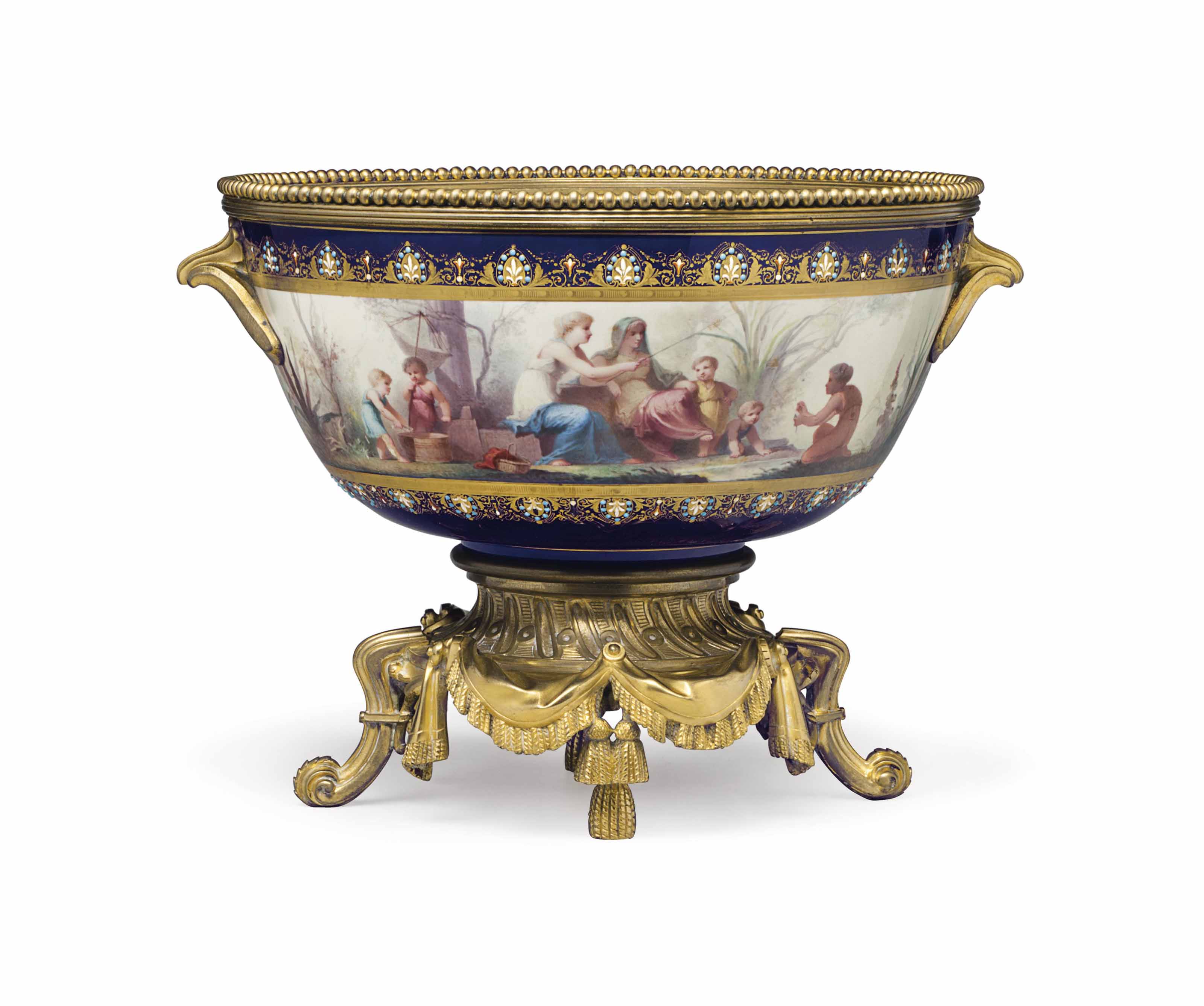 AN ORMOLUMOUNTED SEVRES STYLE PORCELAIN 'JEWELED' COBALTBLUE GROUND
