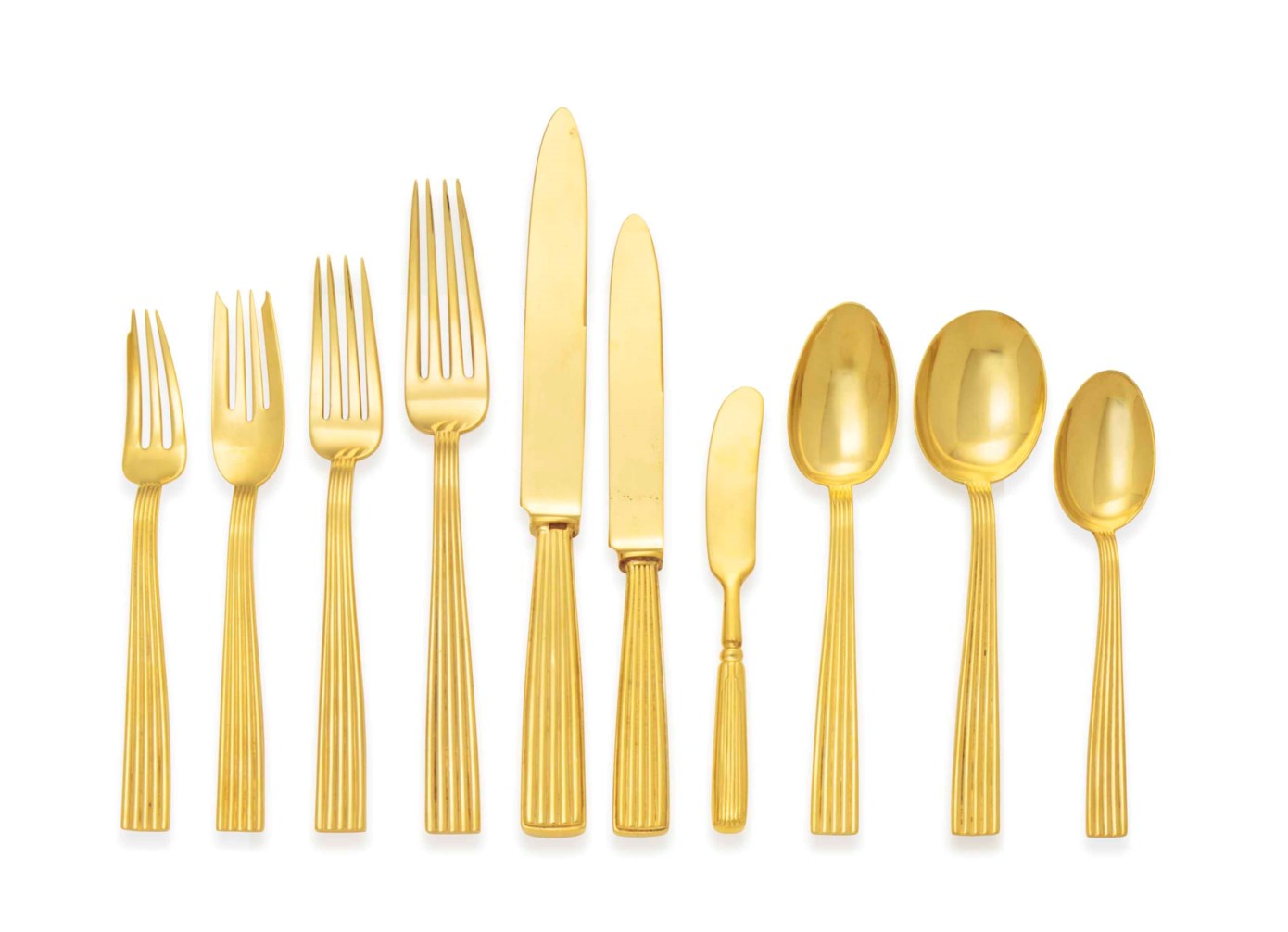AN ITALIAN SILVERGILT FLATWARE SERVICE , MARK OF BUCCELLATI, 20TH