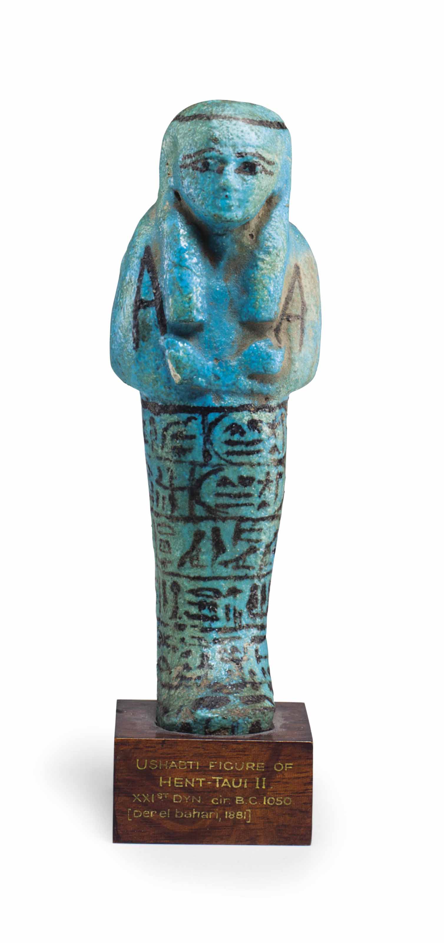 AN EGYPTIAN FAIENCE SHABTI OF QUEEN HENUTTAWY , THIRD INTERMEDIATE