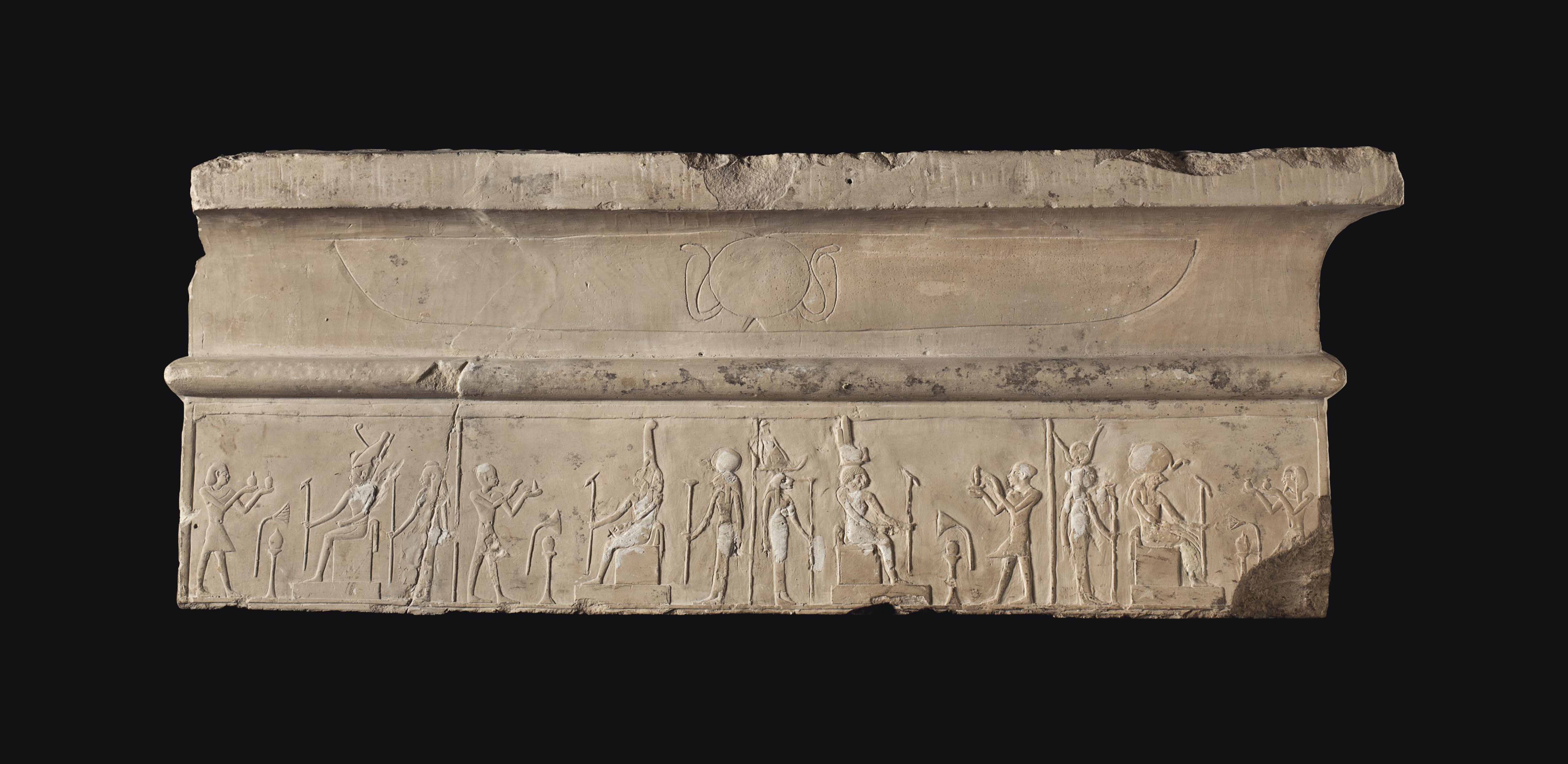 AN EGYPTIAN LIMESTONE LINTEL FRAGMENT , LATE PTOLEMAIC TO ROMAN PERIOD