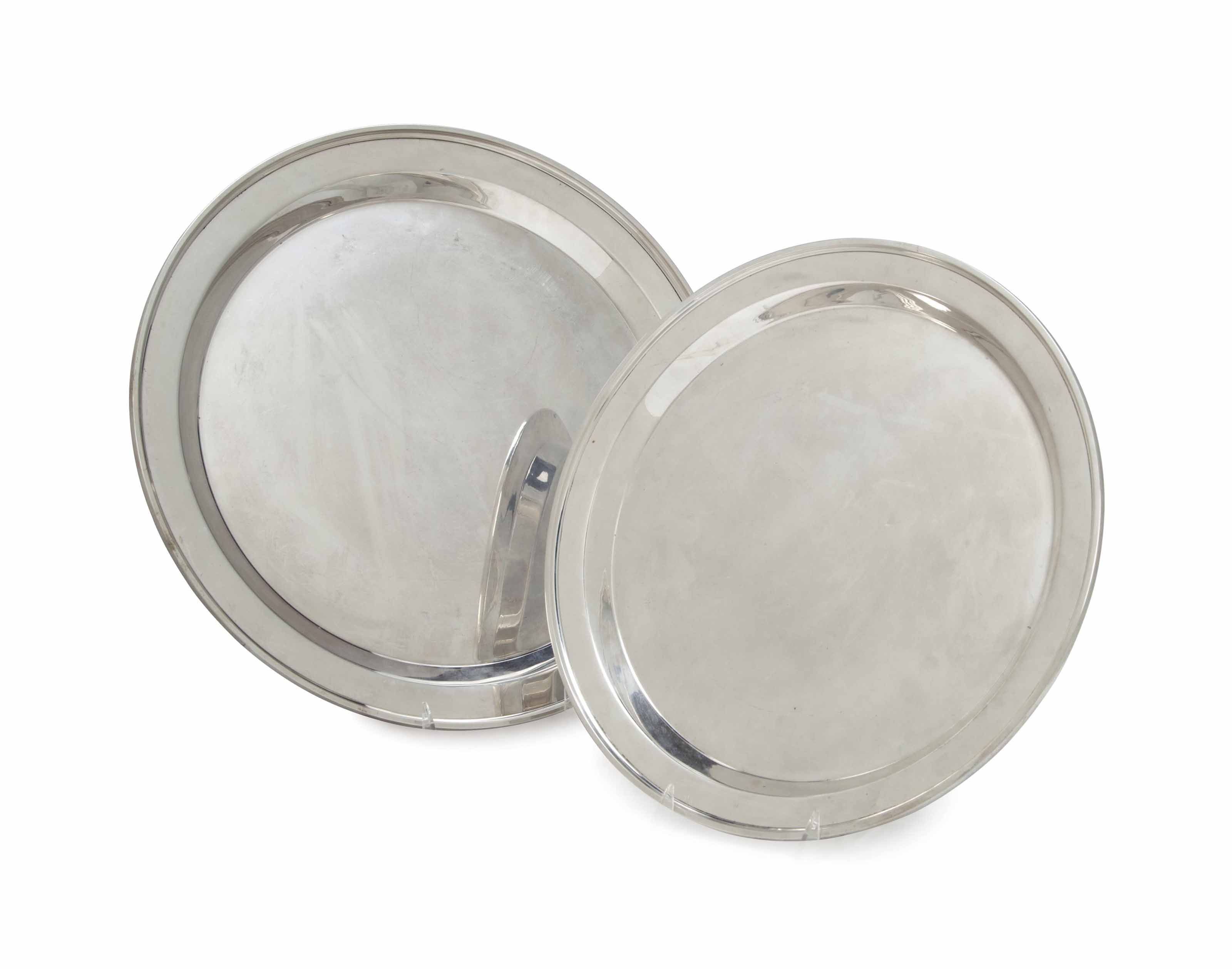 A PAIR OF FRENCH SILVER CIRCULAR CHARGERS IN TWO SIZES,