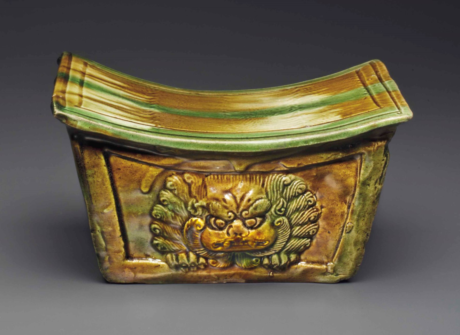 A RARE SANCAIGLAZED MOLDED POTTERY PILLOW