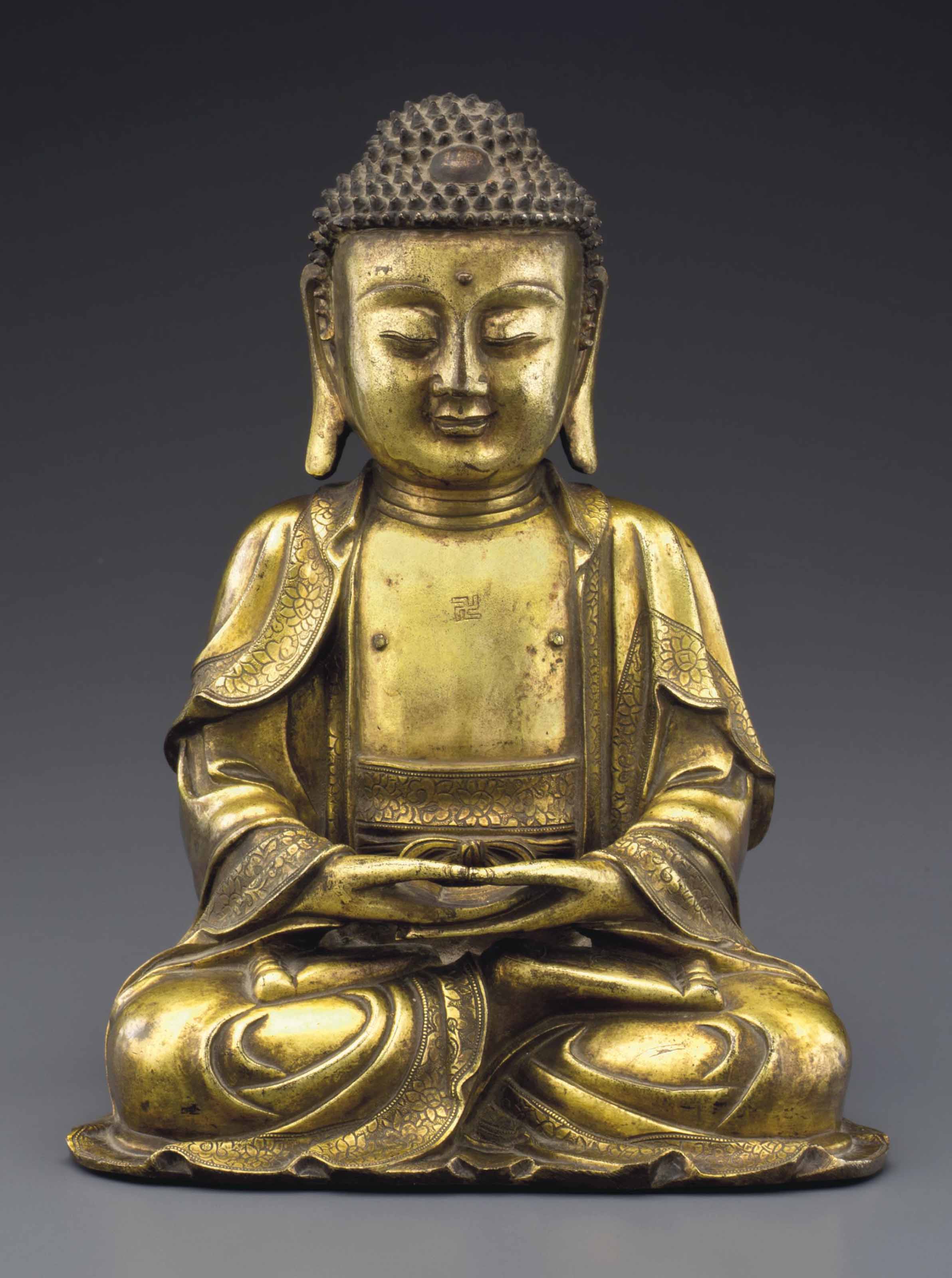 A GILTBRONZE FIGURE OF BUDDHA , MING DYNASTY, 16TH17TH CENTURY