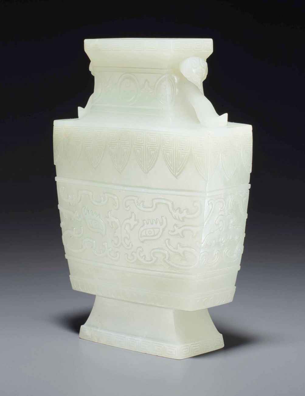 AN ARCHAISTIC PALE GREENISHWHITE JADE FLATTENED SQUARE BALUSTER VASE