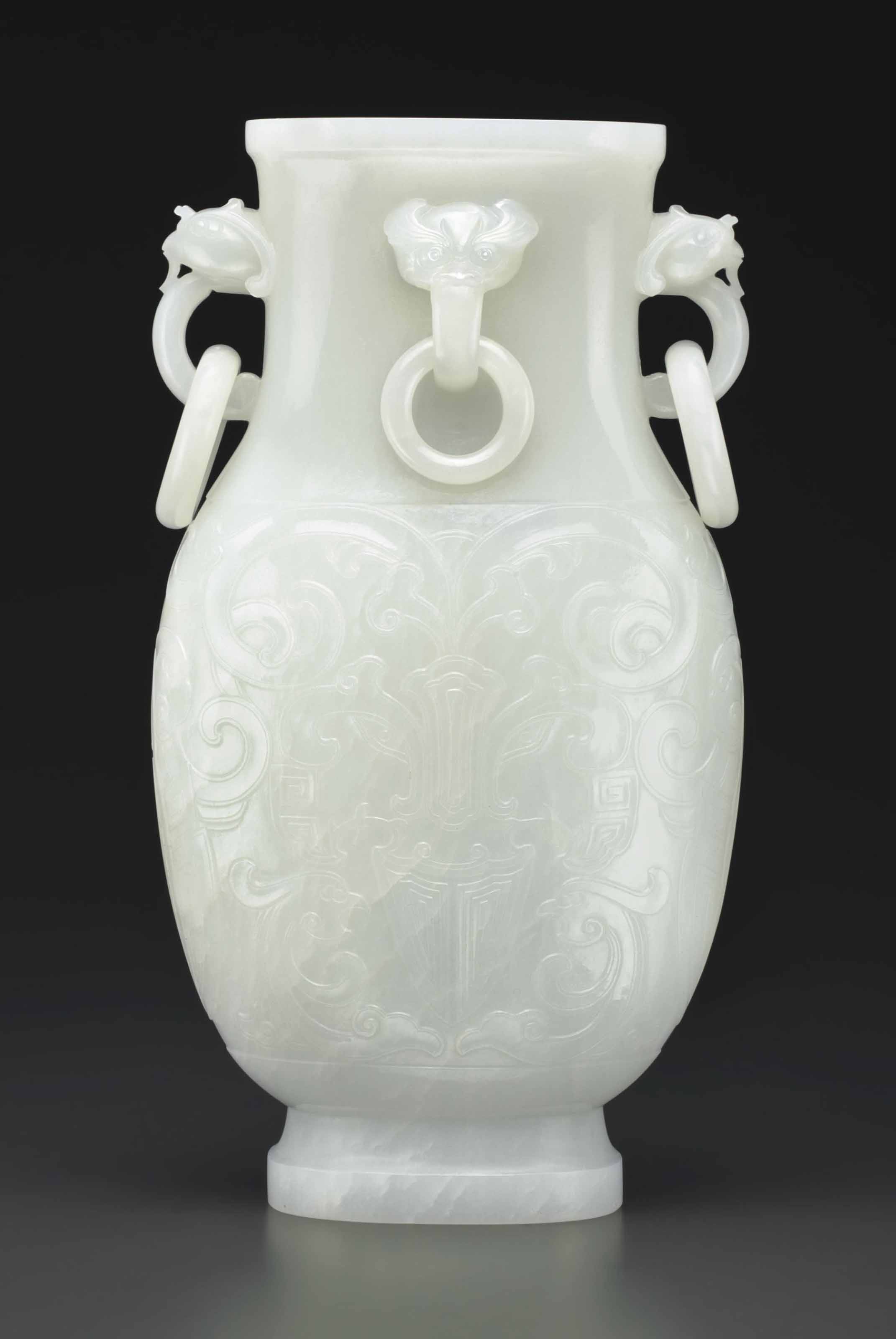 A SUPERB WHITE JADE ARCHAISTIC VASE AND COVER