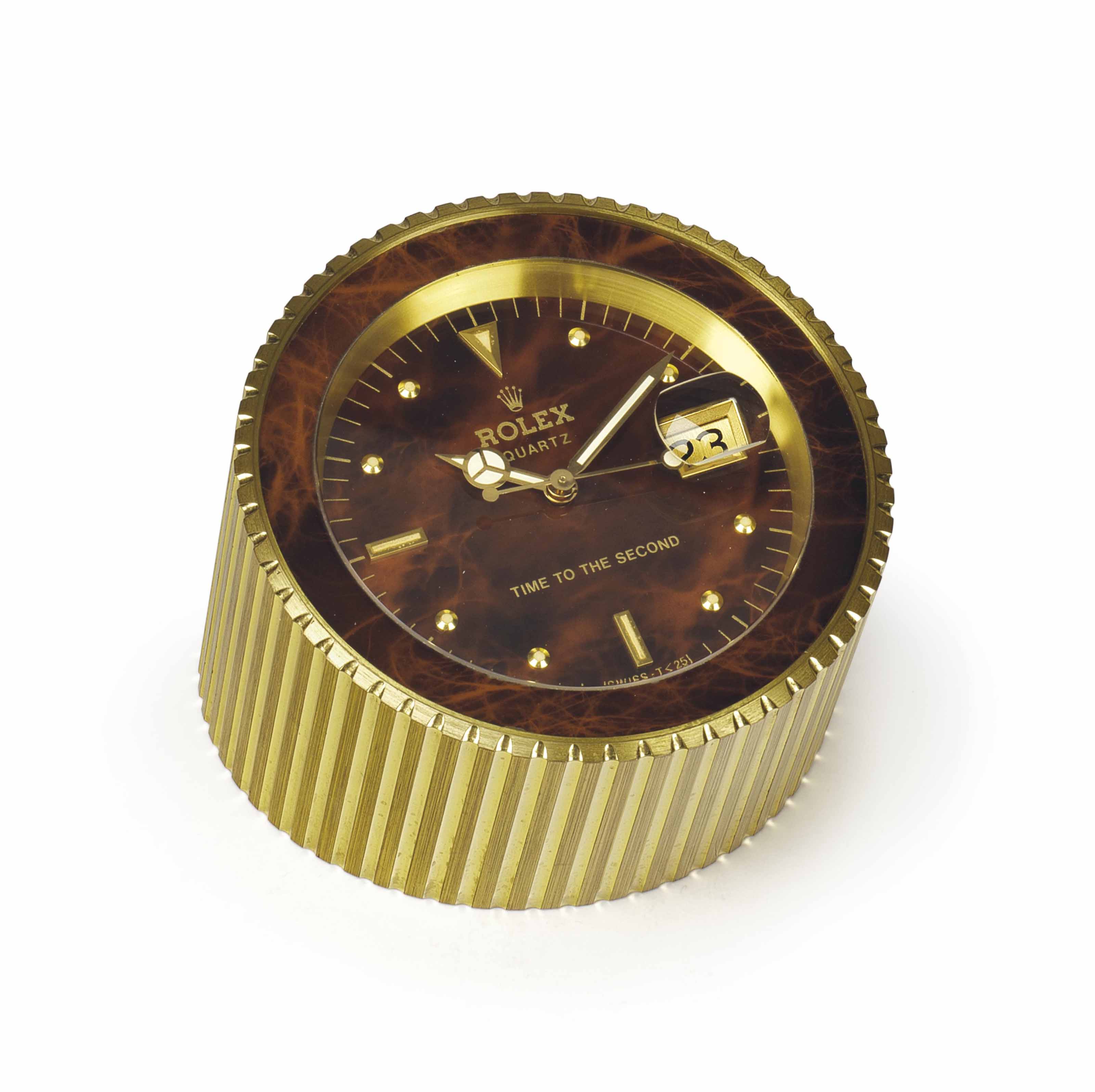 Rolex A Gilt Metal Quartz Desk Clock With Dead Center Seconds And