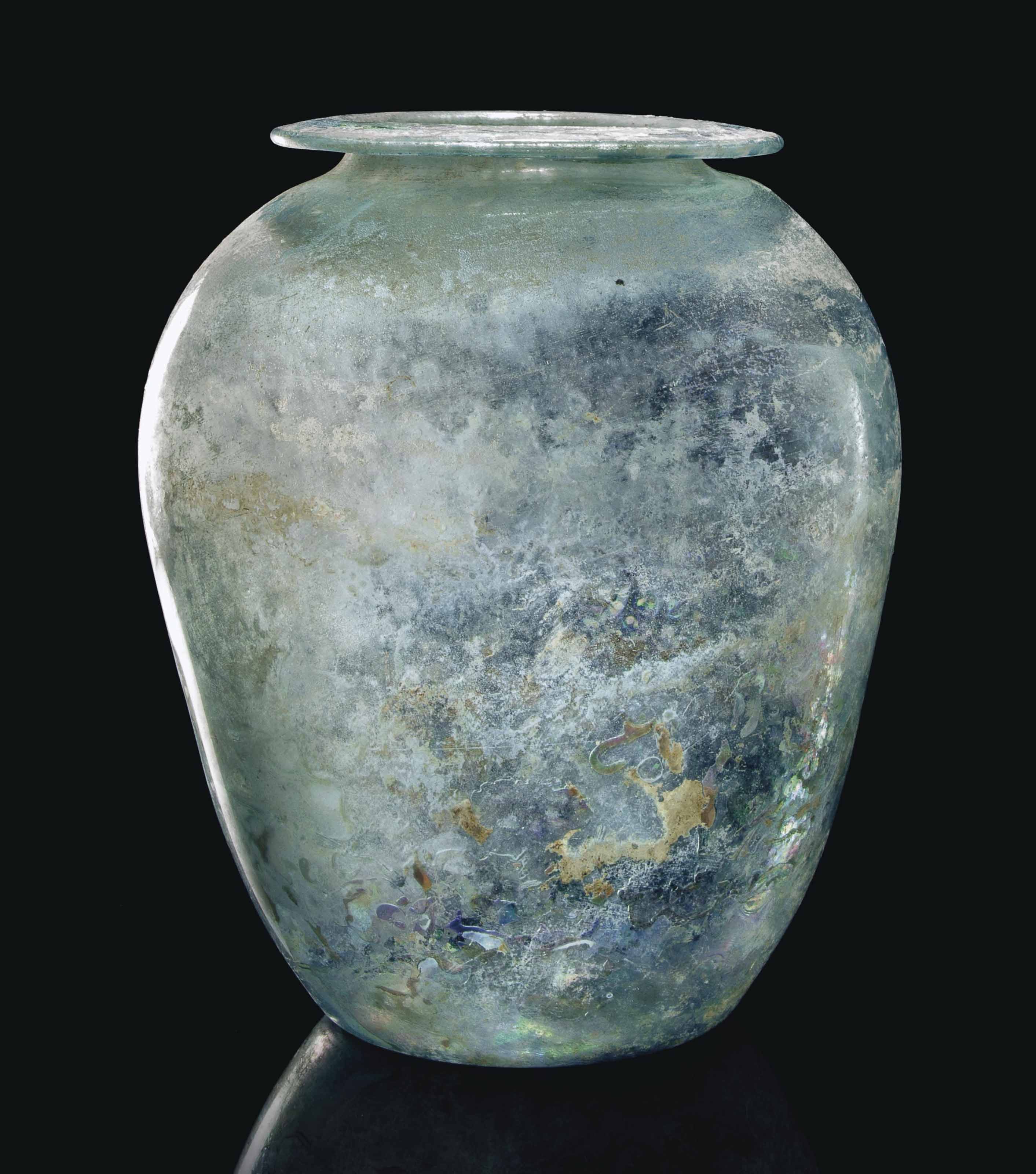 A ROMAN GLASS CINERARY URN , CIRCA 1ST CENTURY A.D. Christie's