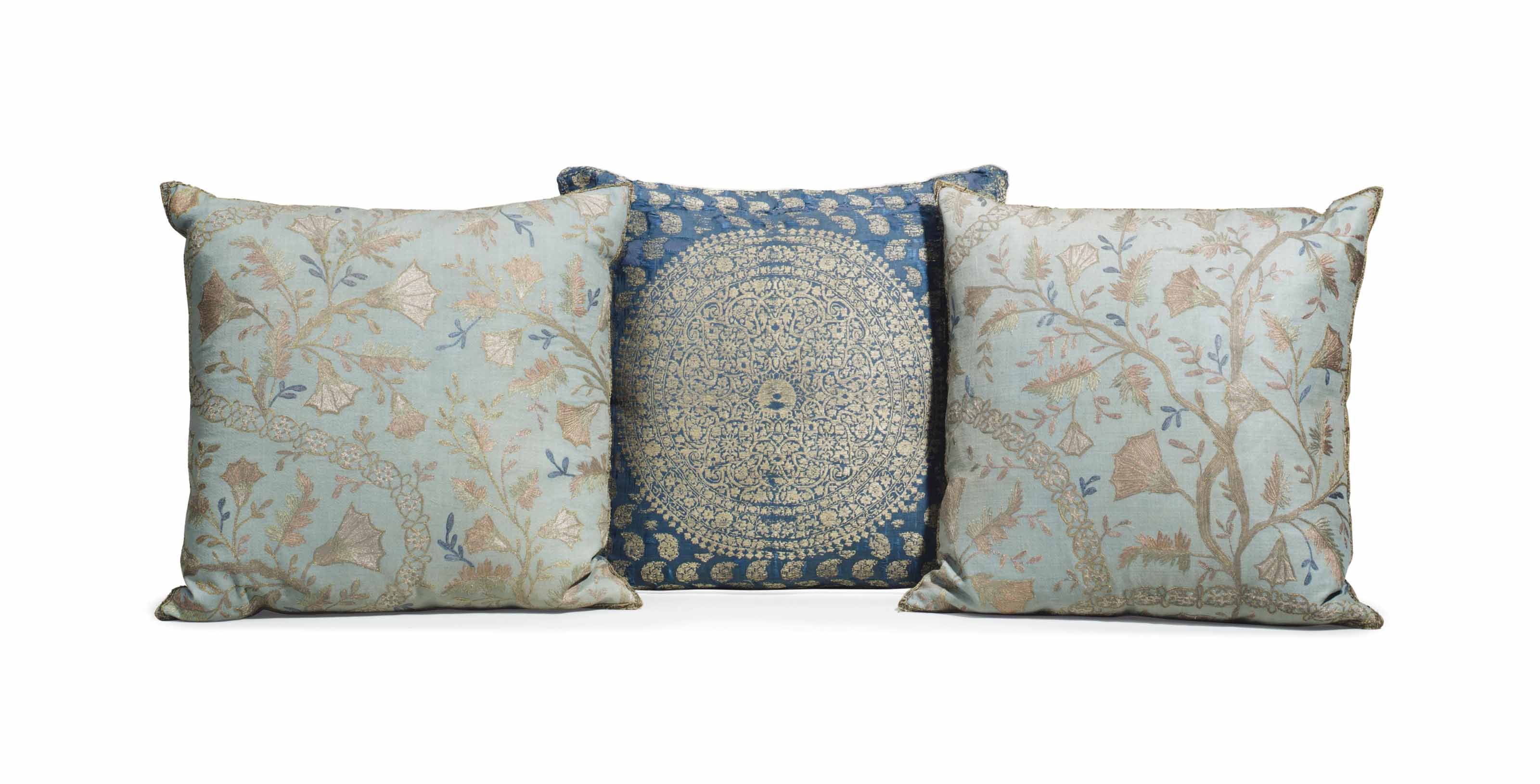 A SET OF THREE SILK CUSHIONS